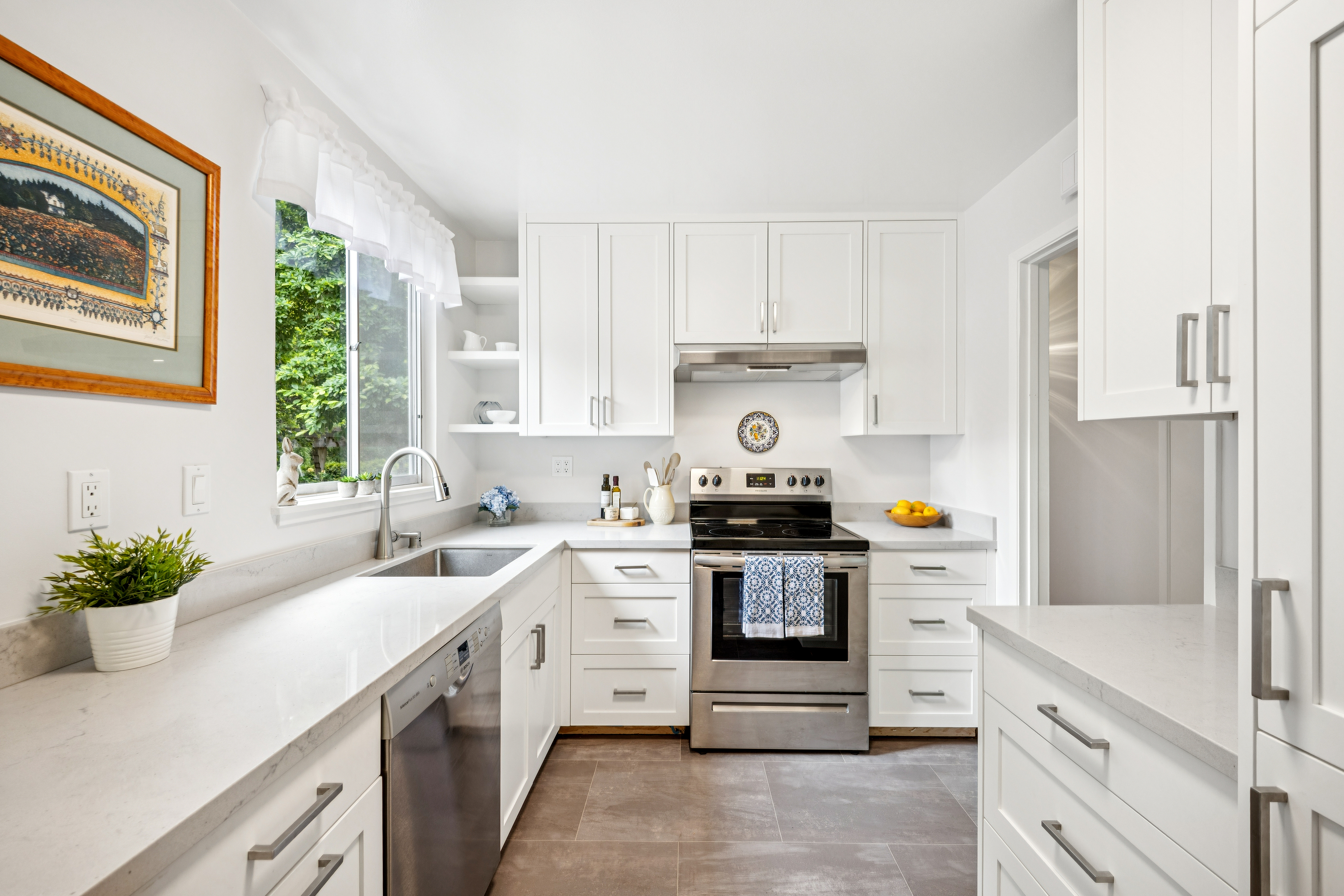 77 Bothin Road Fairfax, CA 94930 - Photo 7 of 32 a kitchen with a white stove top oven and white cabinets