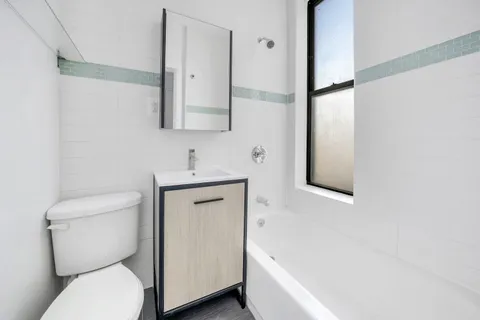 a bathroom with a toilet sink and bathtub