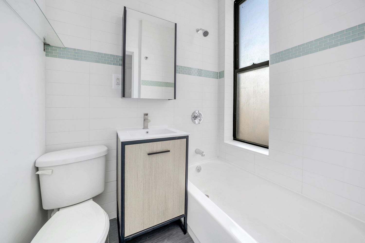 66 West 138th Street, Unit 2D Manhattan, NY 10037 - Photo 4 of 5 a bathroom with a toilet sink and bathtub