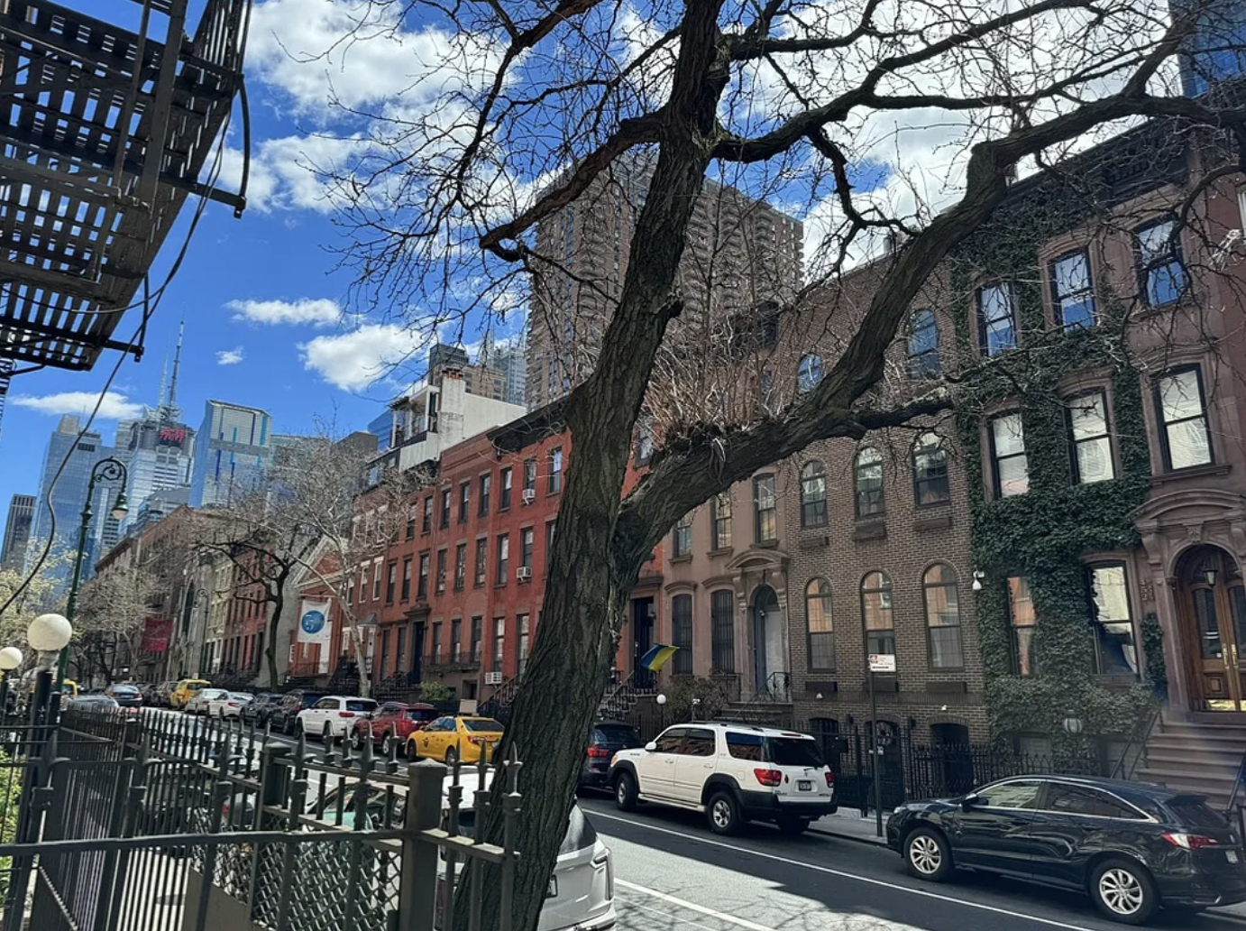 451 West 44th Street, Unit 63 Manhattan, NY 10036 - Photo 21 of 33 a city street lined with tall buildings