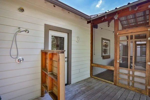 a view of a door and wooden floor