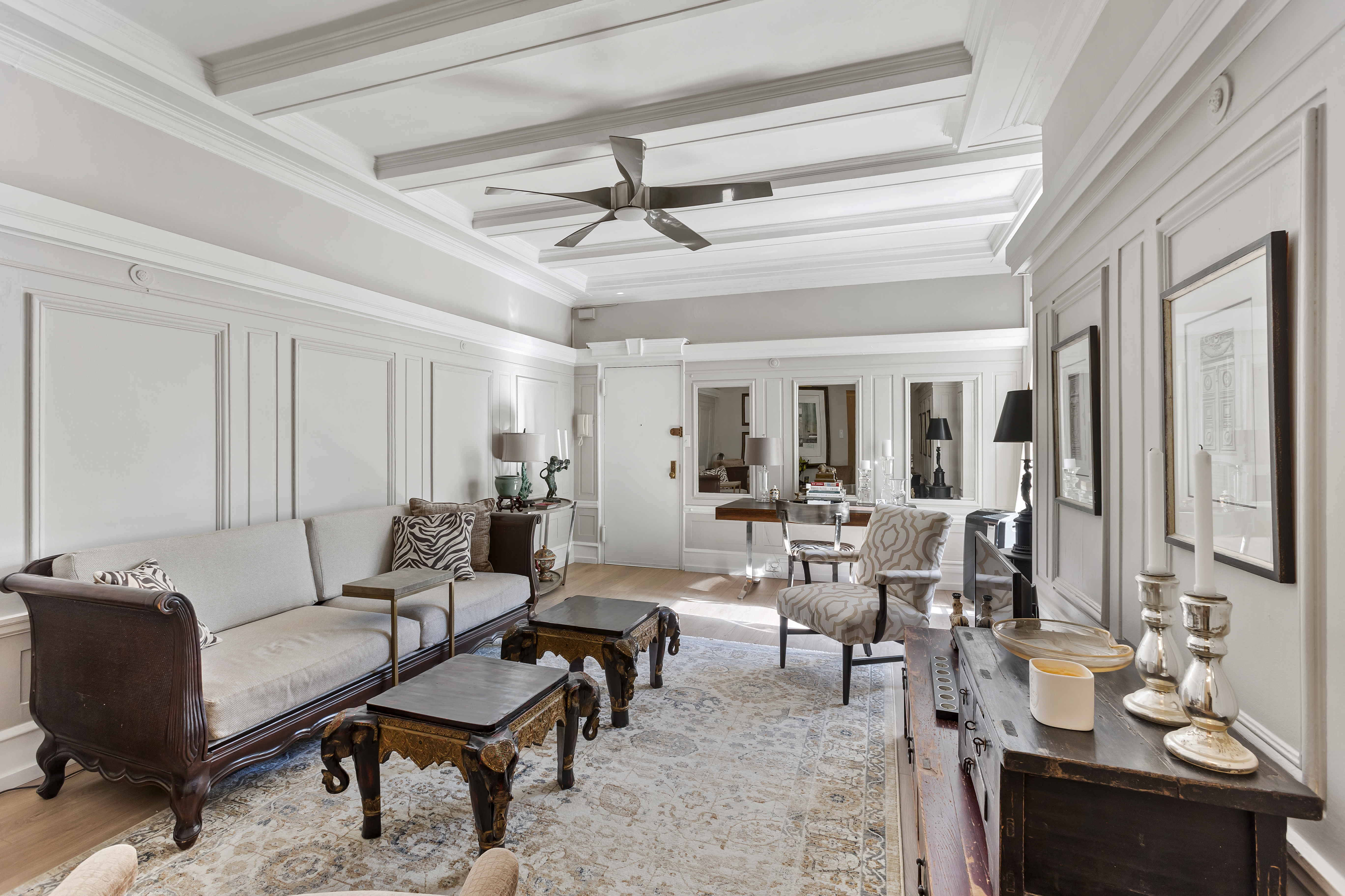 420 Riverside Drive, Unit 7K Manhattan, NY 10025 - Photo 2 of 7 a living room with furniture and a chandelier