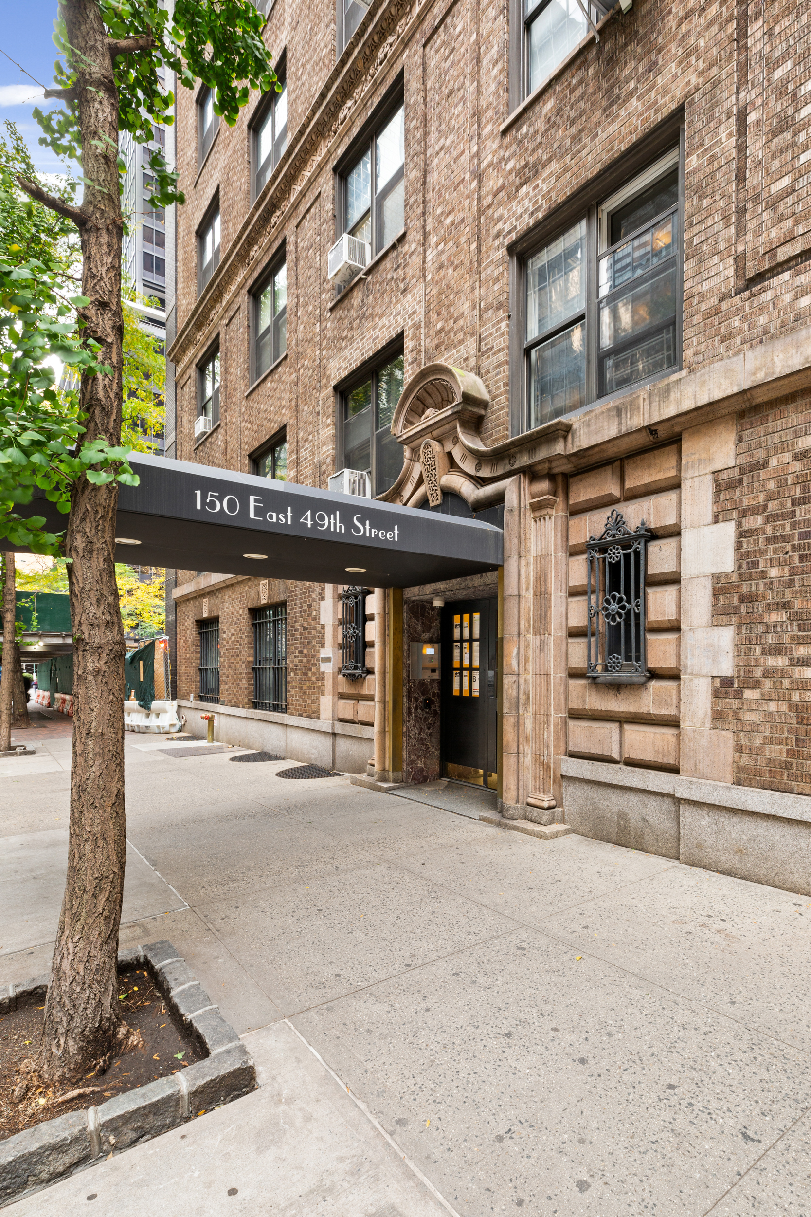 150 East 49th Street, Unit 8B Manhattan, NY 10017 - Photo 7 of 8 a view of a building with a street