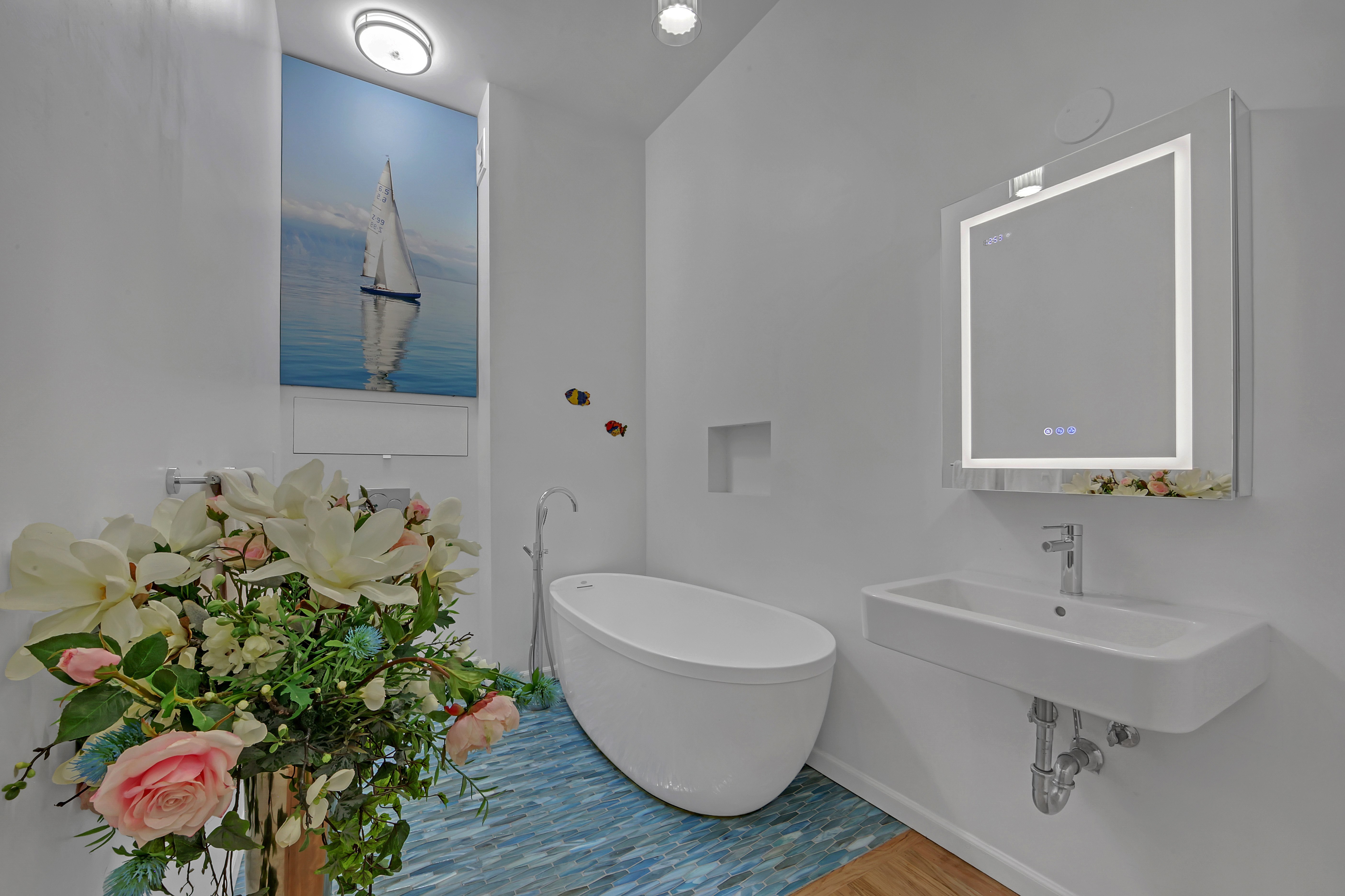 56 East 11th Street, Unit 7 Manhattan, NY 10003 - Photo 9 of 16 a bathroom with a toilet sink and mirror