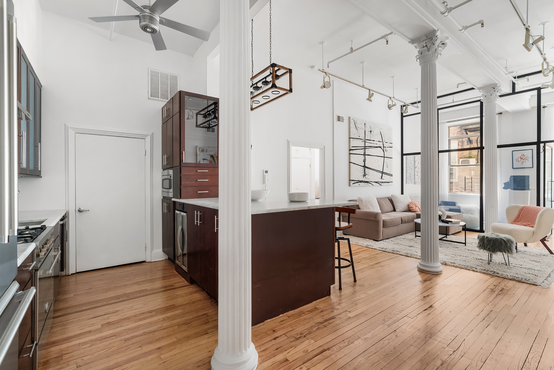 80 Leonard Street, Unit 3G Manhattan, NY 10013 - Photo 3 of 30 a view of a living room and dining room