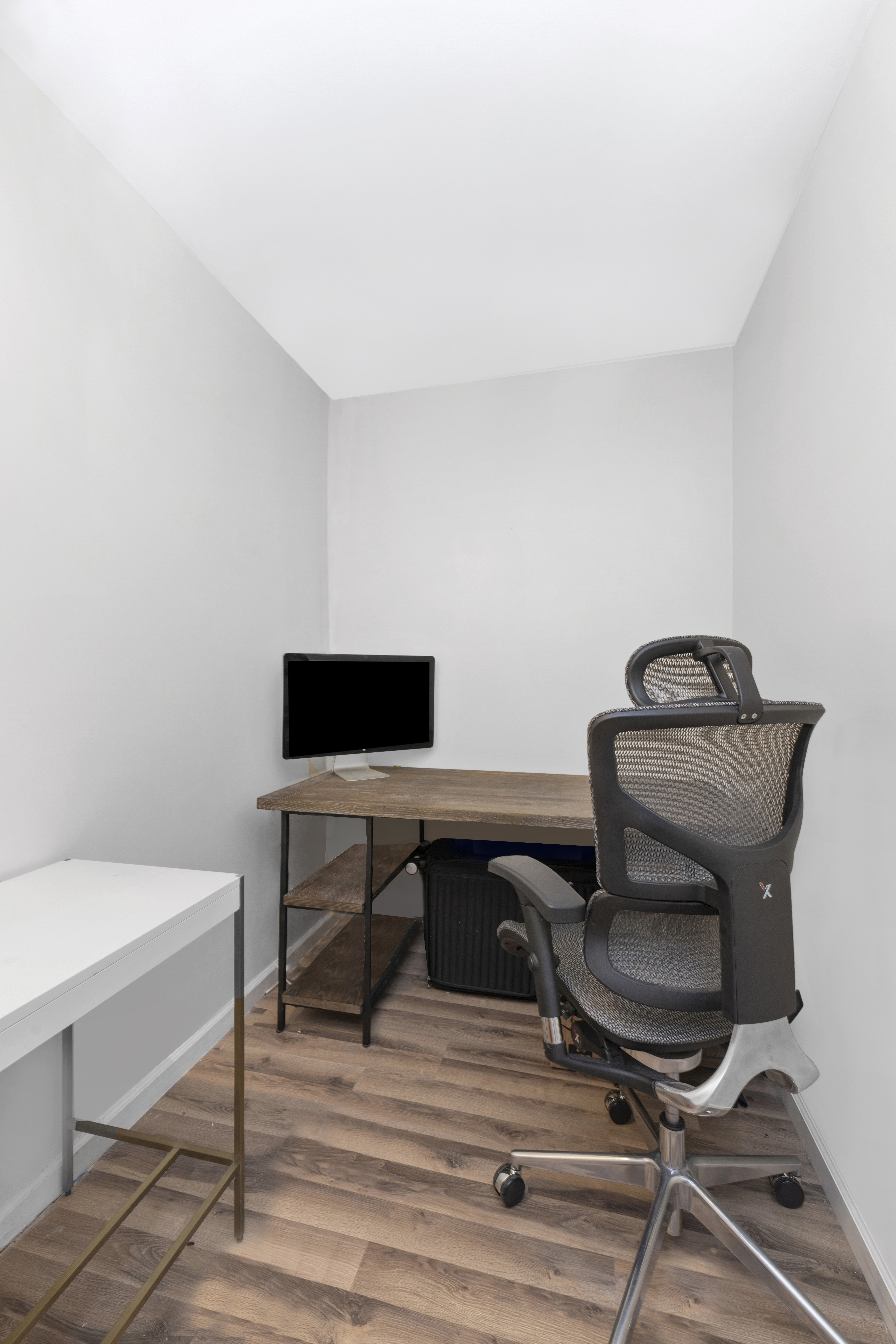 300 Rector Place, Unit 6T Manhattan, NY 10280 - Photo 4 of 14 a view of a workspace with furniture and wooden floor