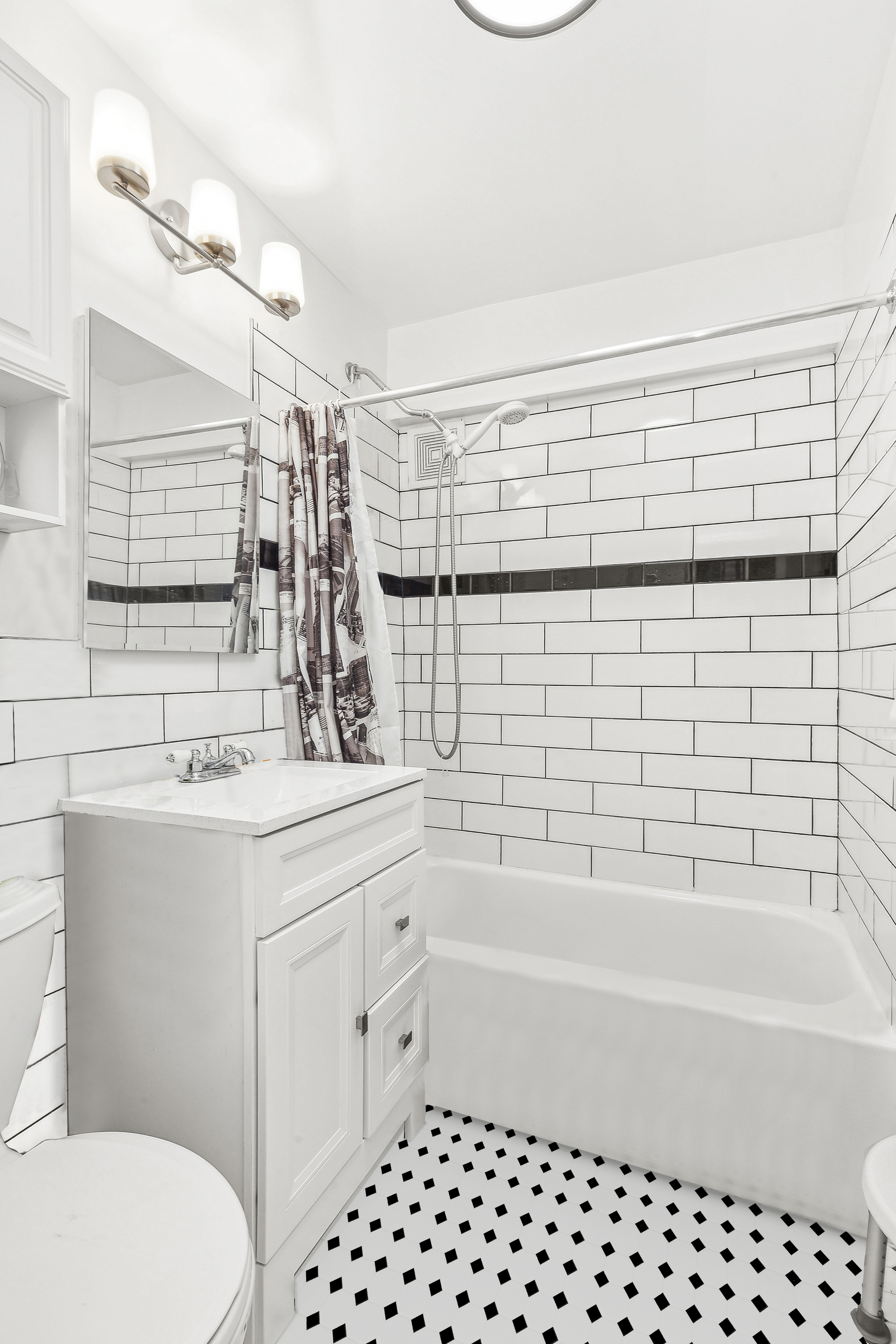 13 West 13th Street, Unit 2DS Manhattan, NY 10011 - Photo 7 of 19 a bathroom with a sink a toilet and shower