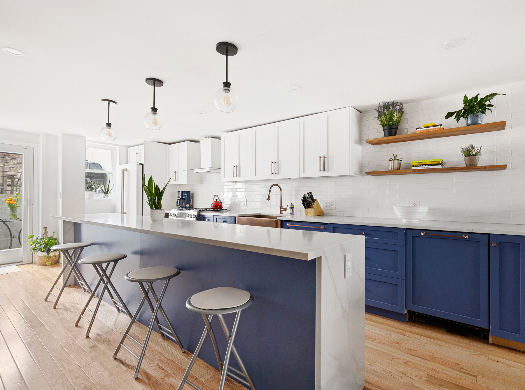 a kitchen with stainless steel appliances granite countertop a sink and cabinets
