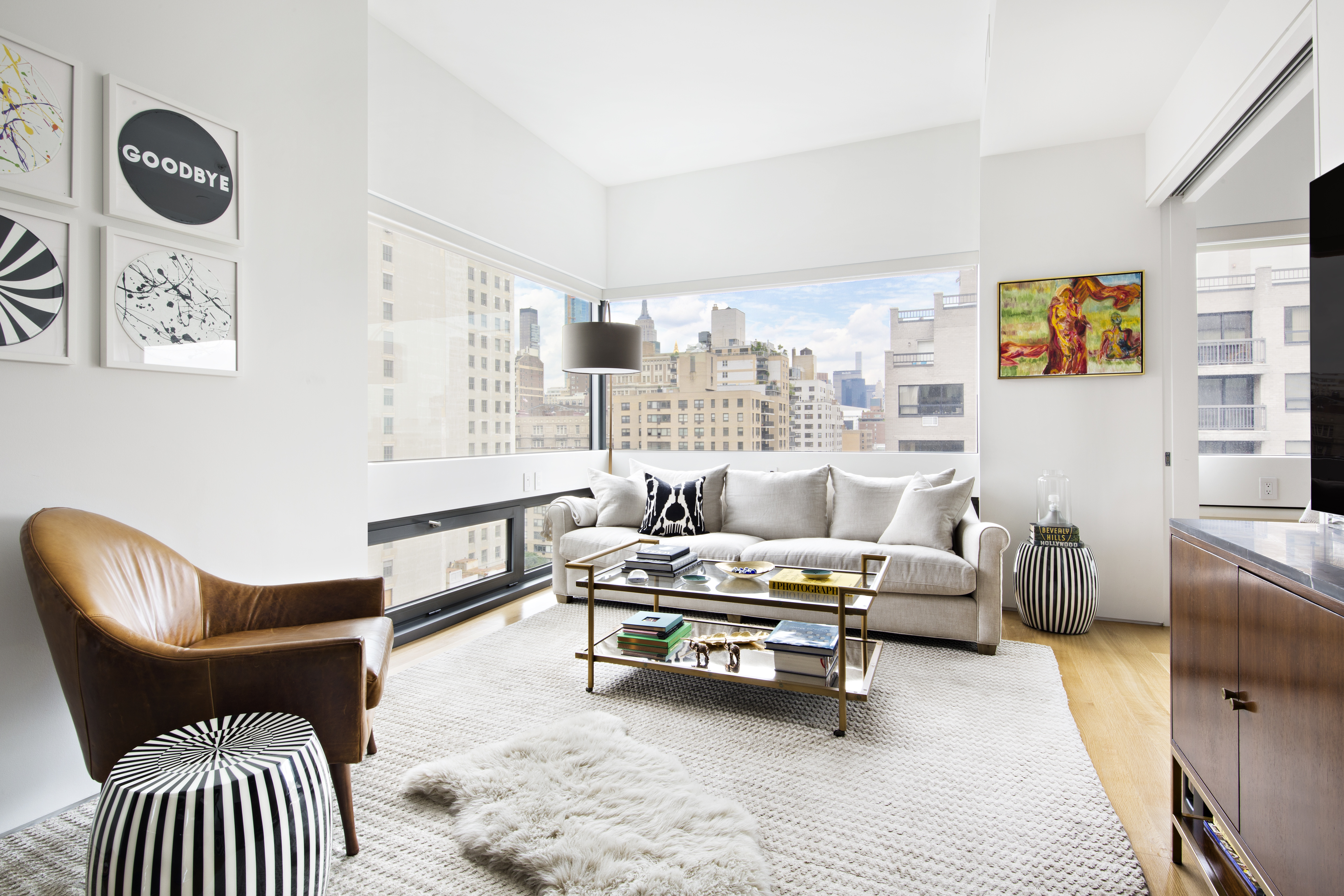 123 3rd Avenue, Unit 11A Manhattan, NY 10003 - Photo 2 of 11 a living room with furniture and wooden floor