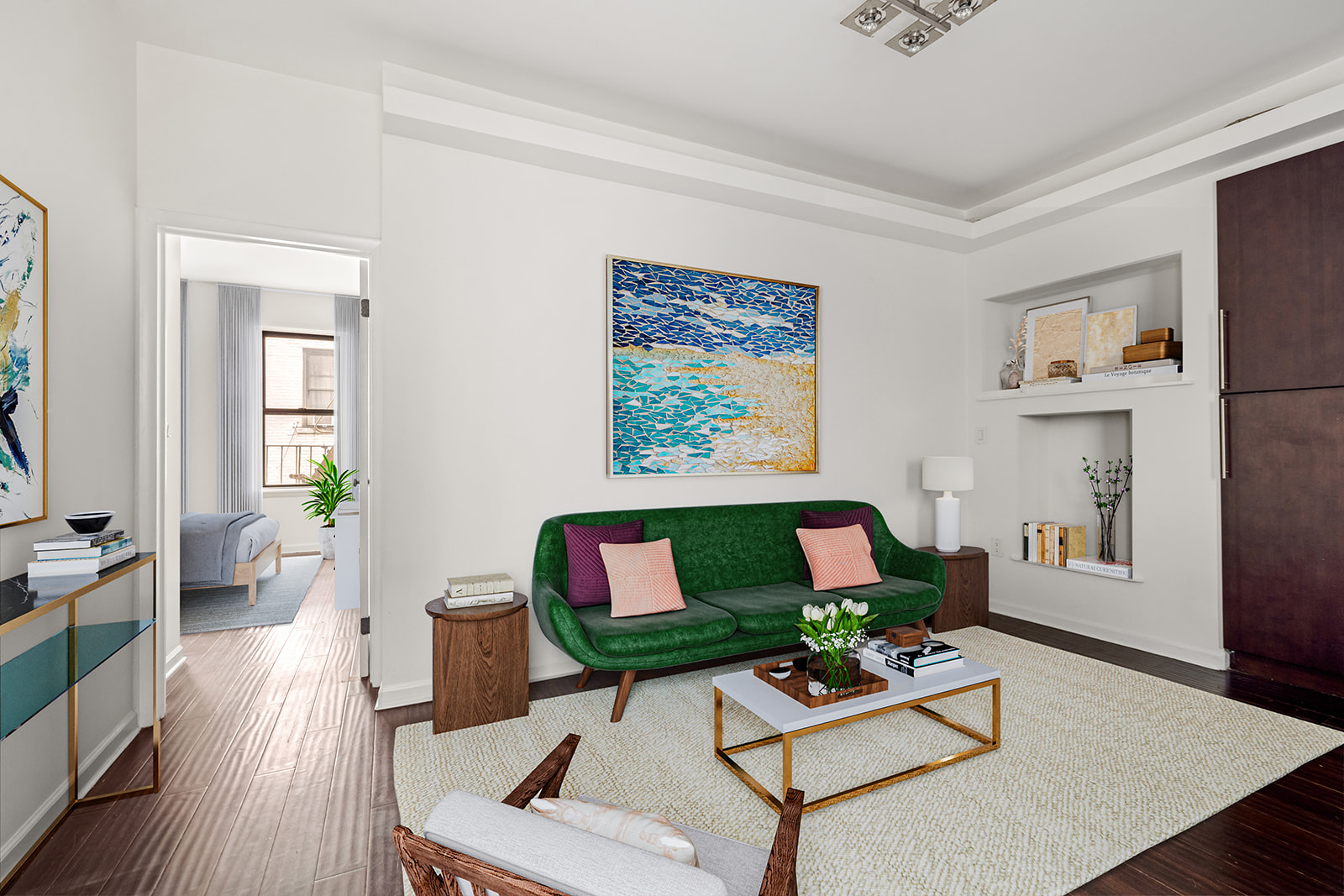 a living room with furniture and wooden floor