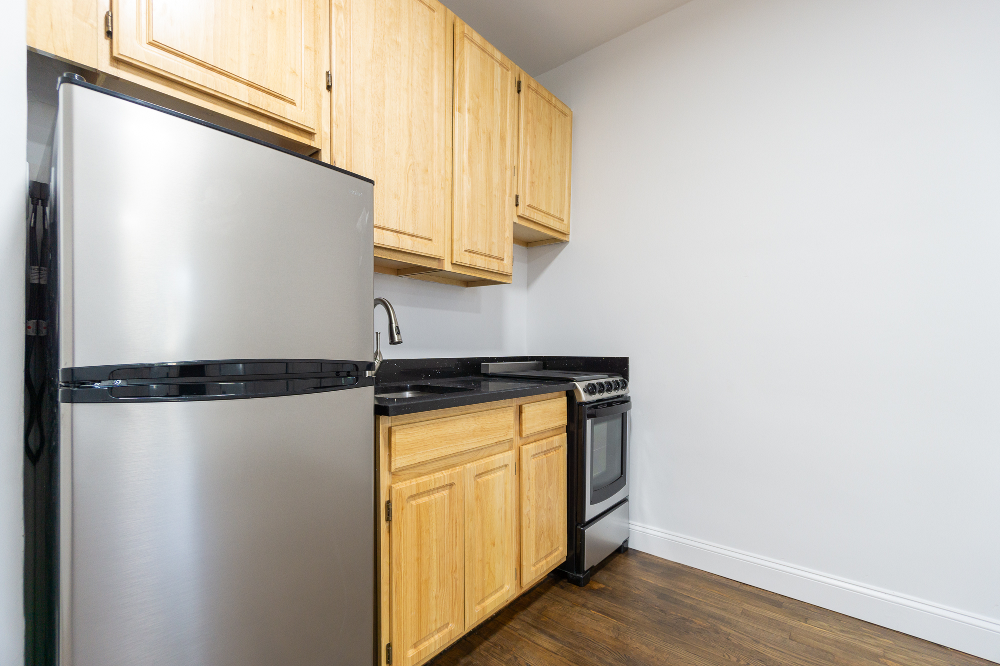 315 East 5th Street, Unit 5D Manhattan, NY 10003 - Photo 5 of 8 a view of a storage and utility room with wooden floor