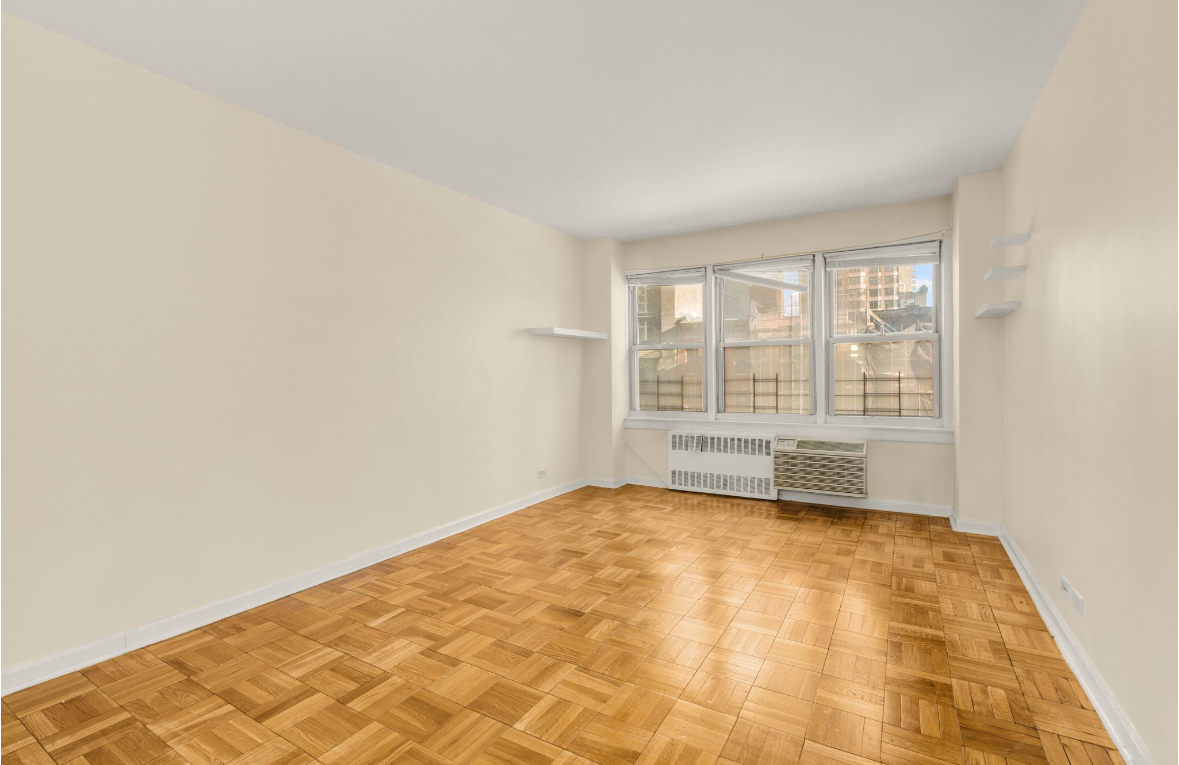 155 East 38th Street, Unit 5G Manhattan, NY 10016 - Photo 5 of 7 a view of an empty room with a window
