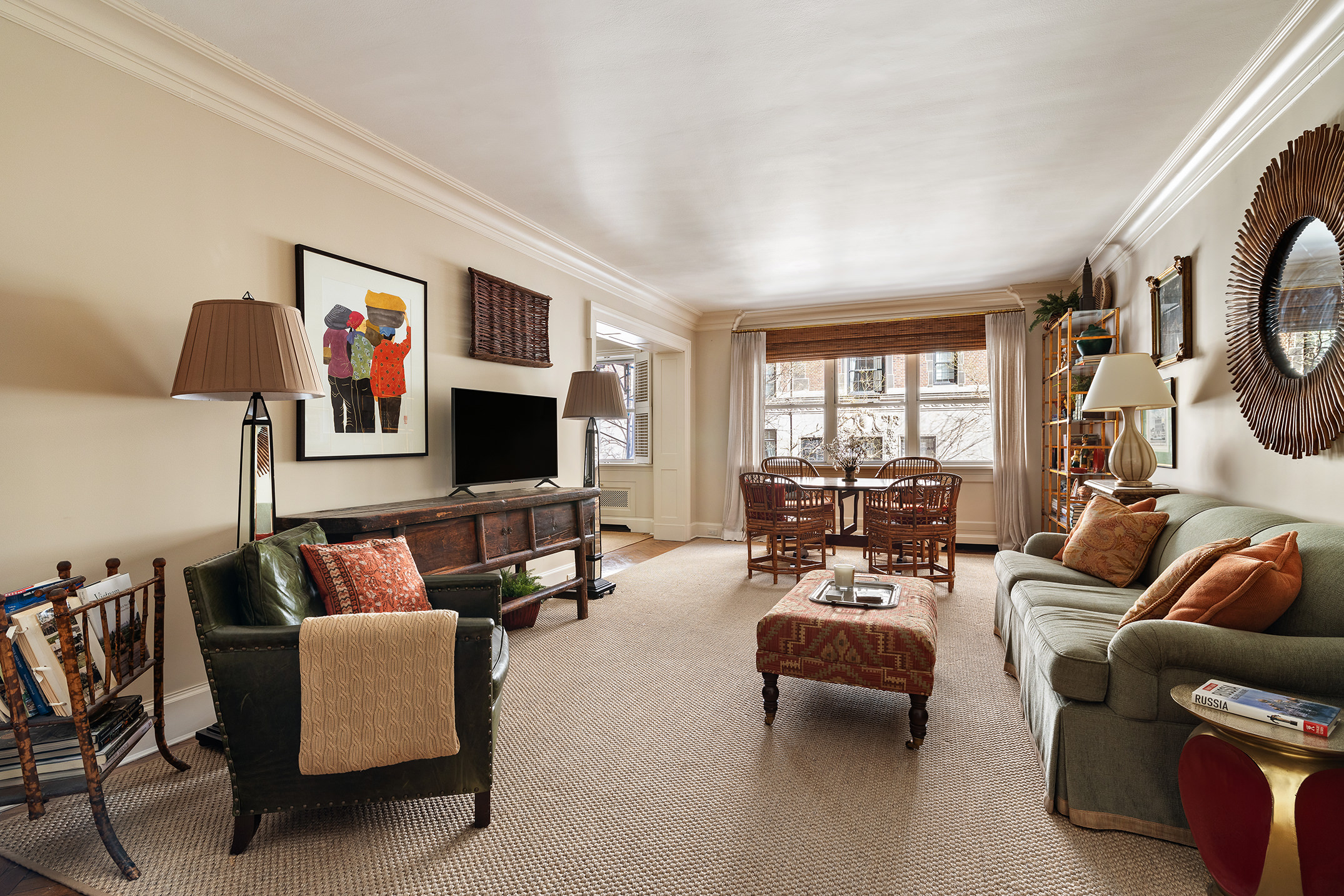 710 Park Avenue, Unit 4D Manhattan, NY 10021 - Photo 3 of 13 a living room with furniture and a flat screen tv