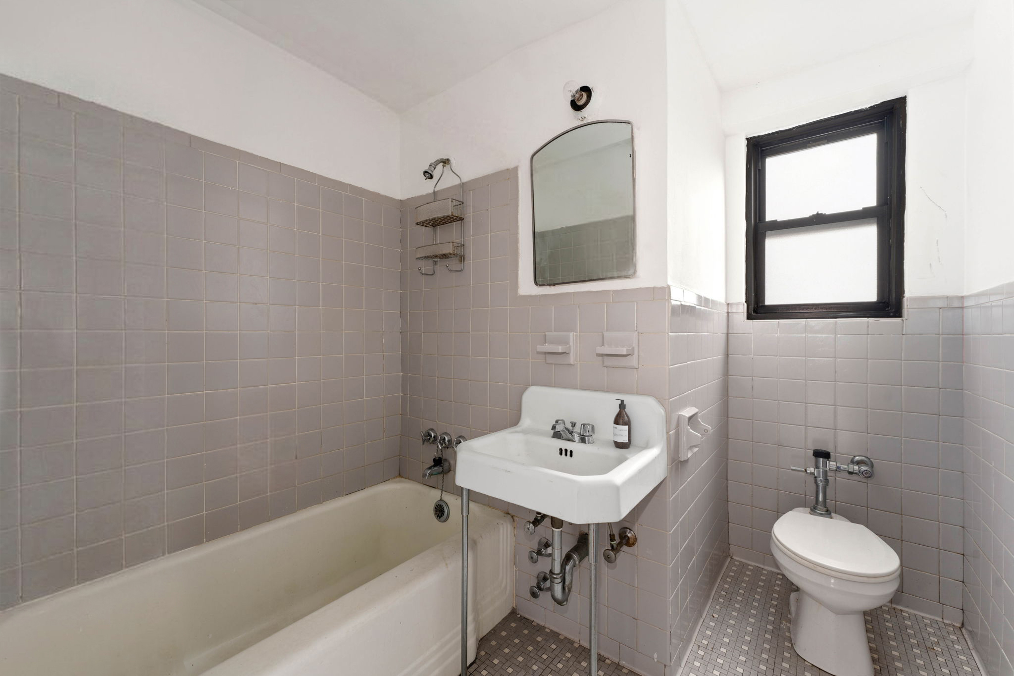 345 West 145th Street, Unit 5A1 Manhattan, NY 10032 - Photo 5 of 9 a bathroom with a sink toilet and bathtub