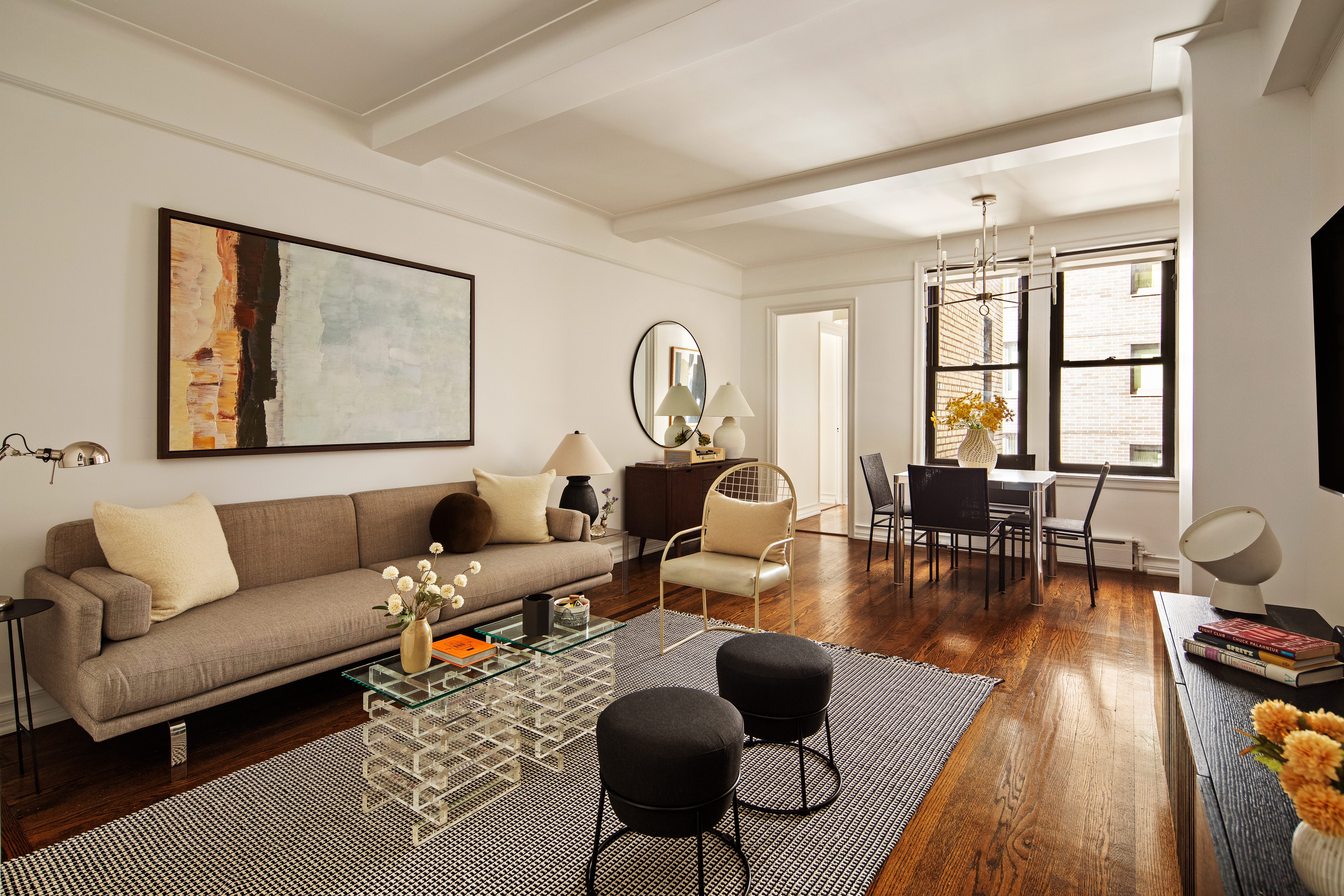 a living room with furniture and wooden floor