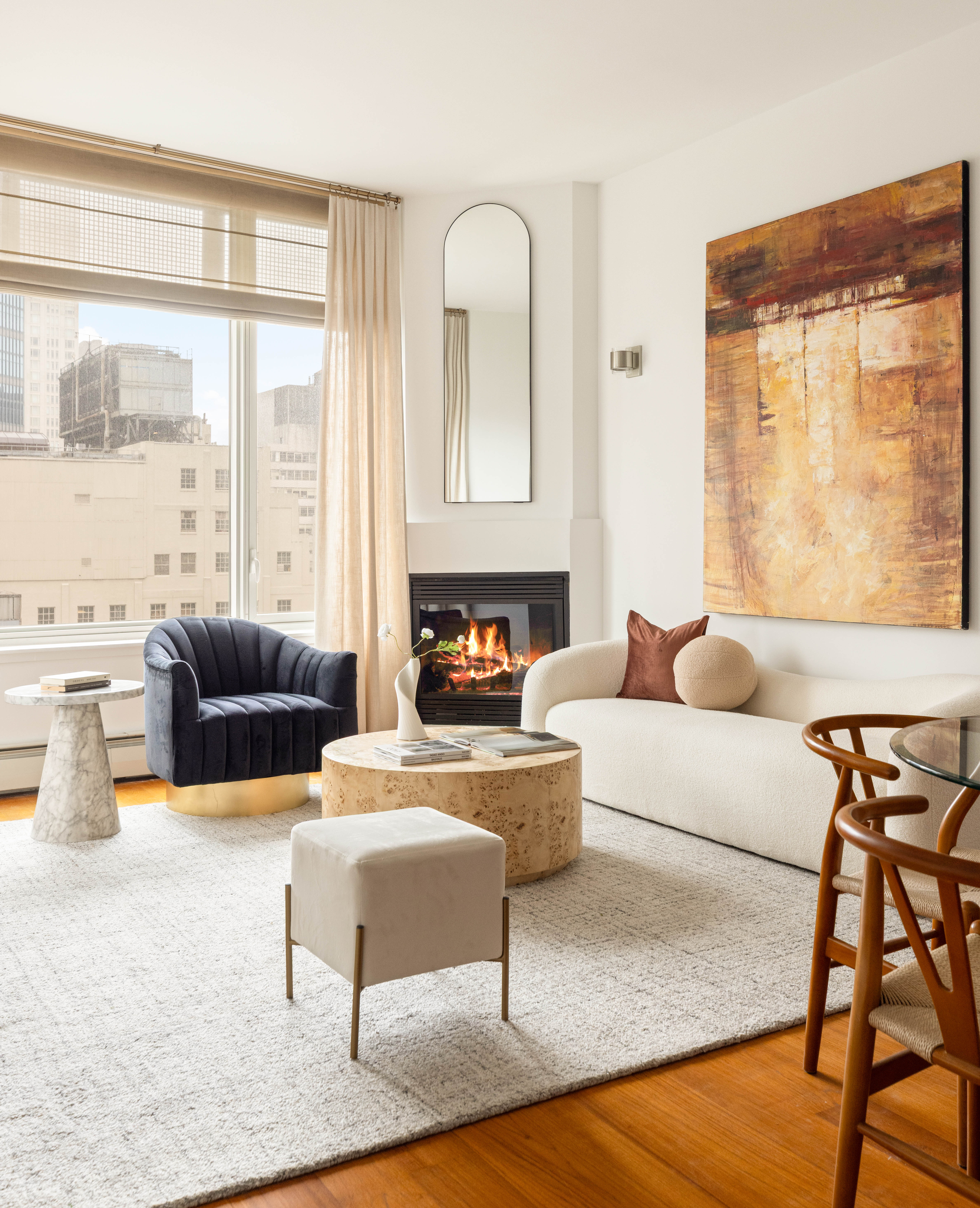 205 East 59th Street, Unit 14B Manhattan, NY 10022 - Photo 2 of 19 a living room with furniture and a large window