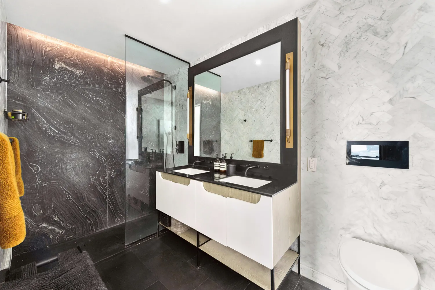 a bathroom with a sink a toilet and a mirror