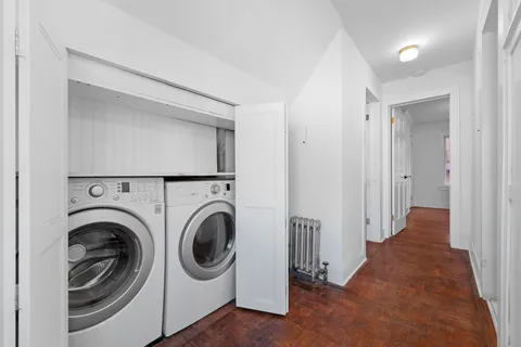 a view of a hallway with washer and dryer