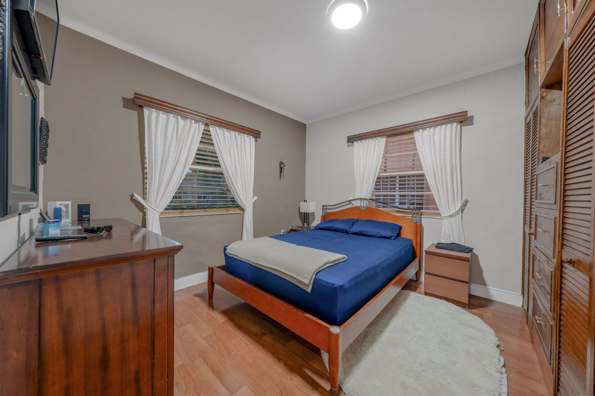 735-745 Meridian Avenue Miami Beach, FL 33139 - Photo 44 of 62 a bedroom with a bed and a window