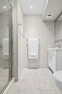 a view of a storage & utility room with closet dryer and washer