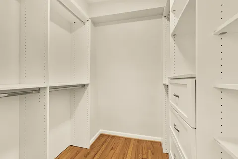 a bathroom with a toilet sink and shower
