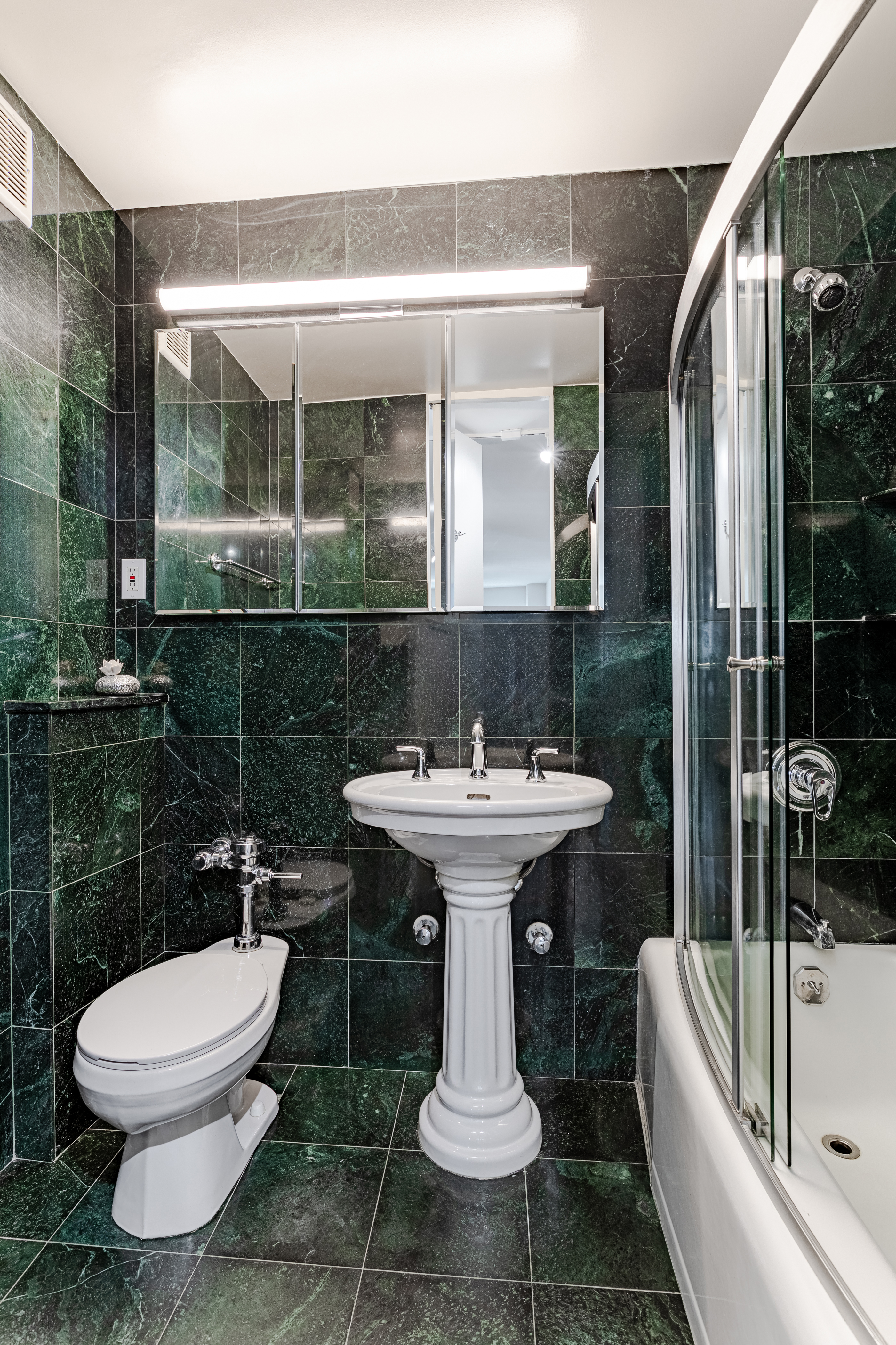 155 East 38th Street, Unit 10D Manhattan, NY 10016 - Photo 13 of 15 a bathroom with a sink toilet and shower