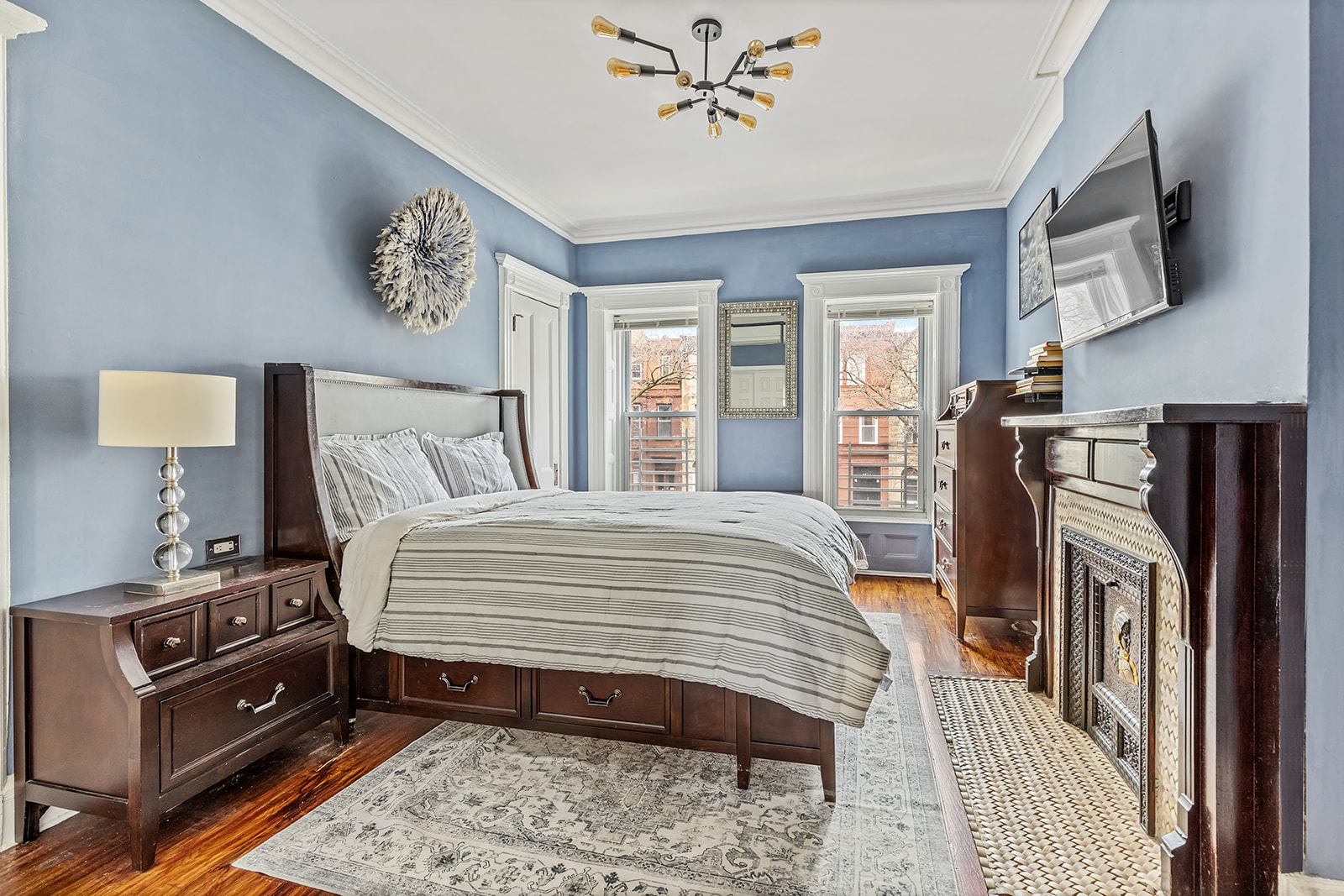 480 A MacDonough Street Brooklyn, NY 11233 - Photo 4 of 10 a bedroom with a bed and a flat screen tv