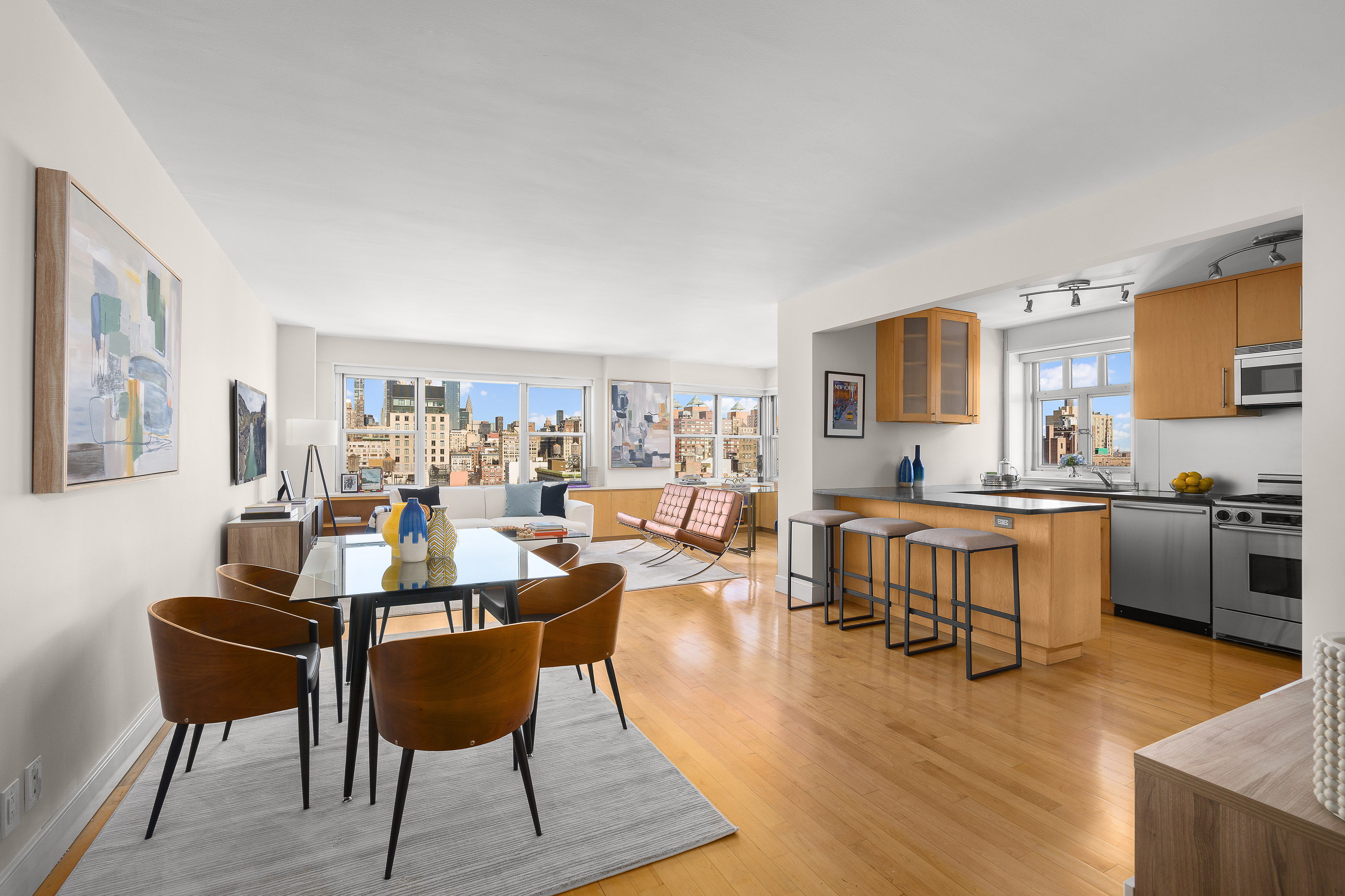 20 East 9th Street, Unit 22C Manhattan, NY 10003 - Photo 3 of 21 a view of a dining room with furniture and wooden floor