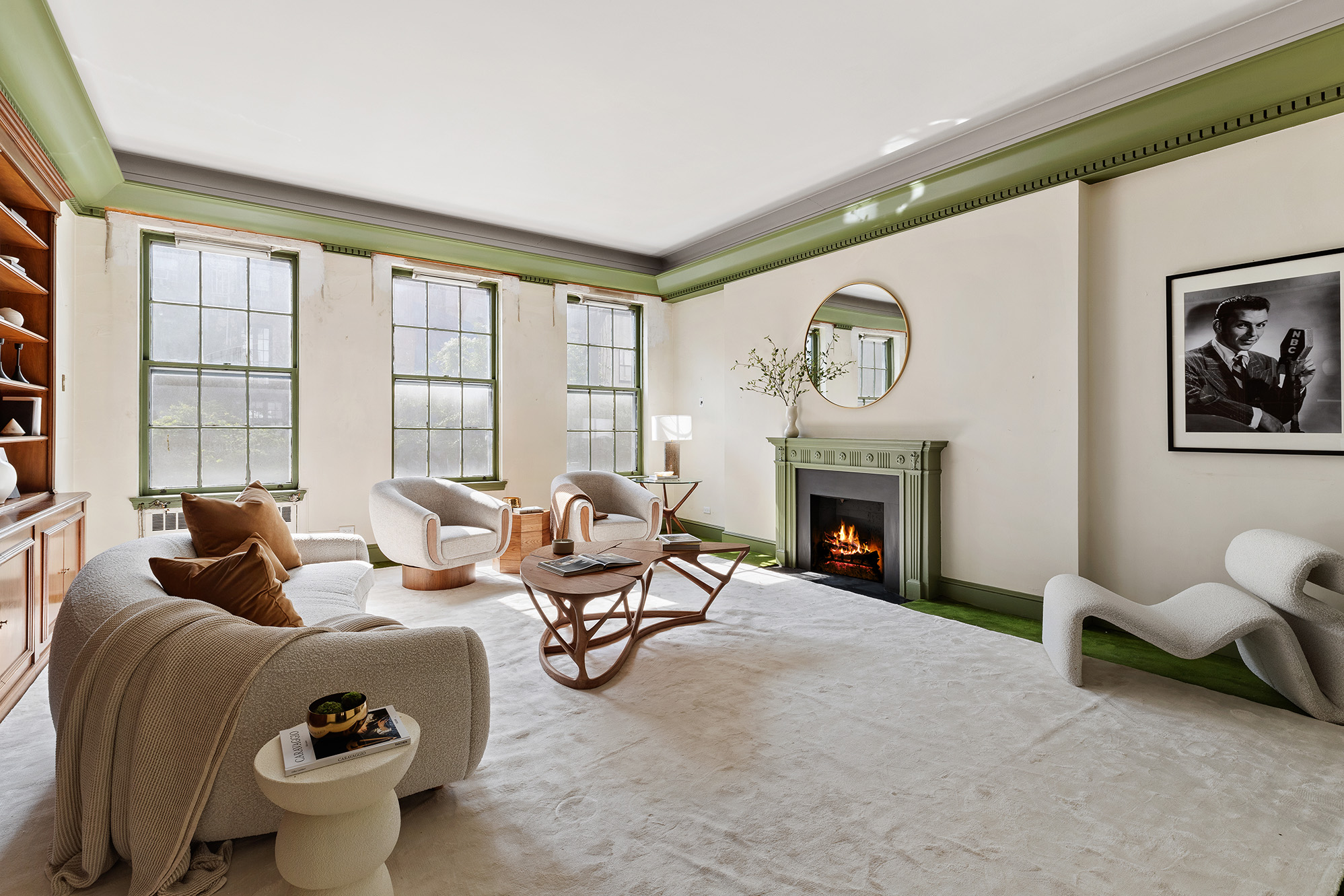 10 East 82nd Street Manhattan, NY 10028 - Photo 4 of 22 a living room with furniture a fireplace and a large window