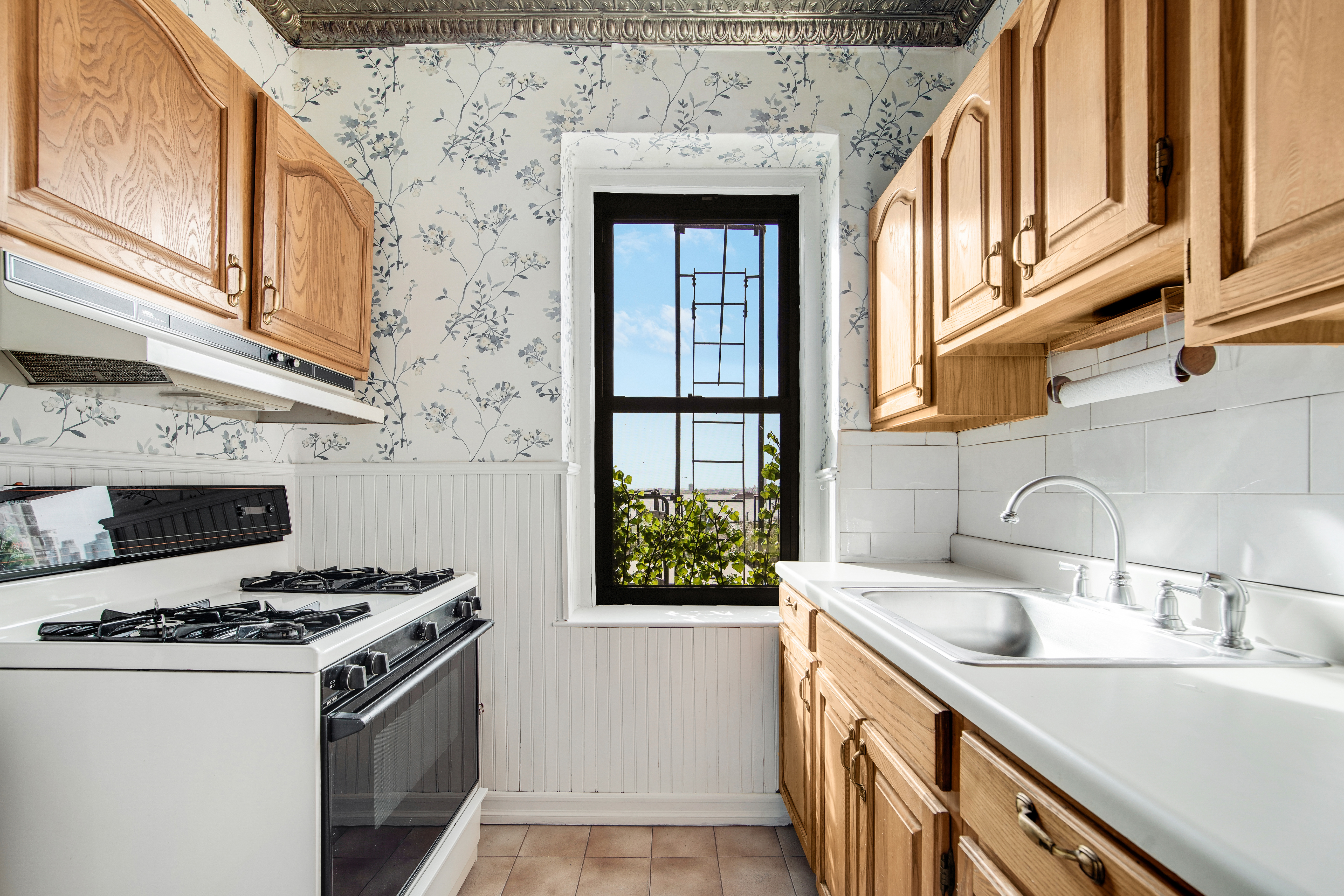 2 Grace Court, Unit 1X Brooklyn, NY 11201 - Photo 5 of 12 a kitchen with granite countertop a sink and a stove