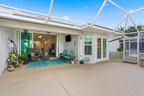 a view of a house with porch and furniture