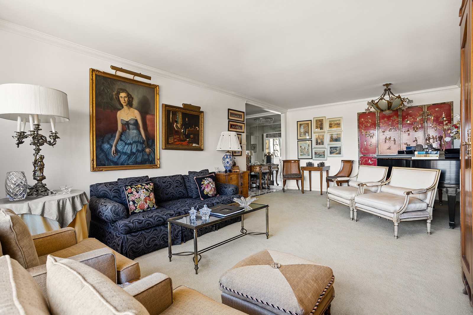 50 East 79th Street, Unit 12B Manhattan, NY 10075 - Photo 3 of 13 a living room with furniture and a painting on the wall