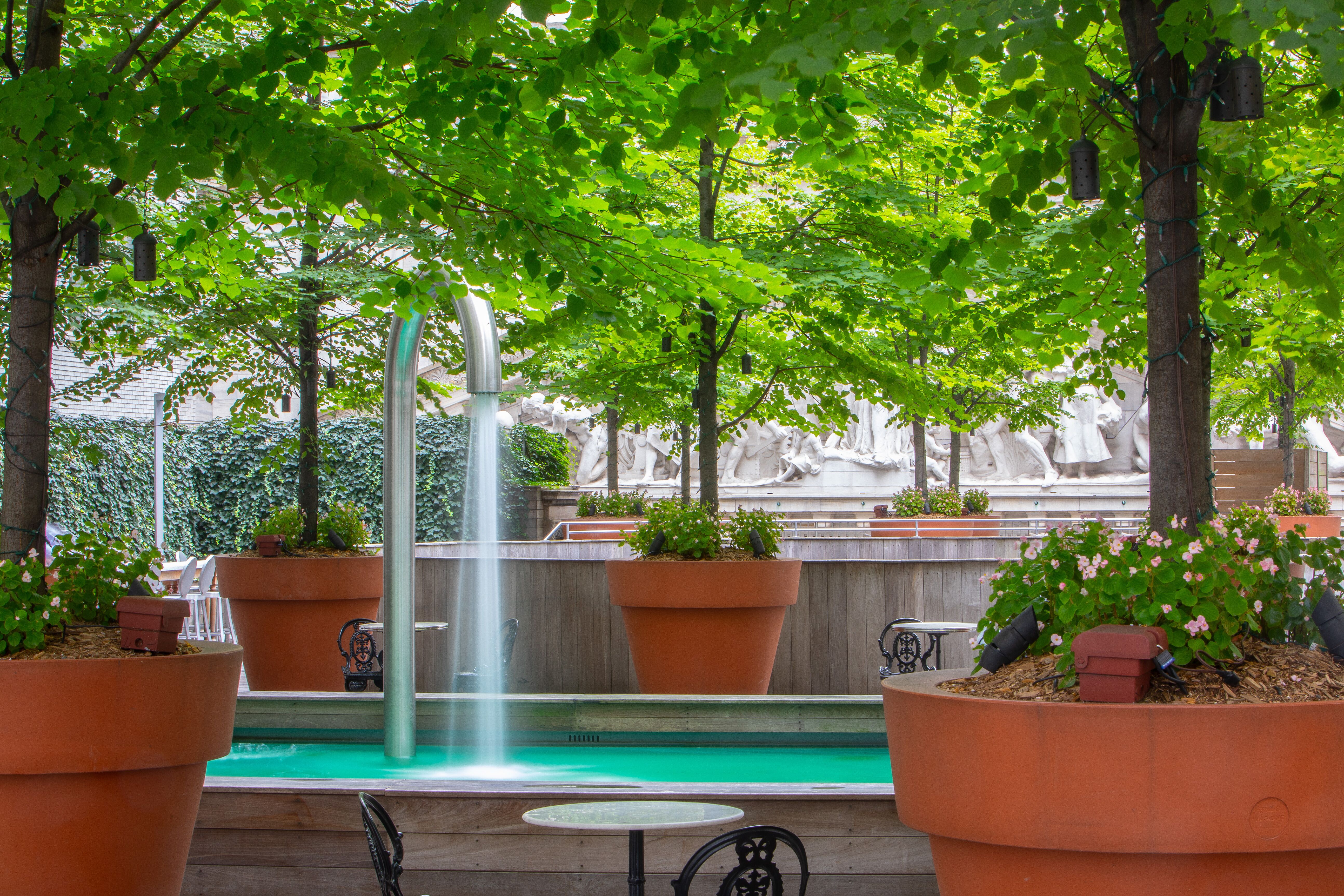 15 Broad Street, Unit 1900 Manhattan, NY 10005 - Photo 26 of 29 a view of a house with backyard sitting area and garden