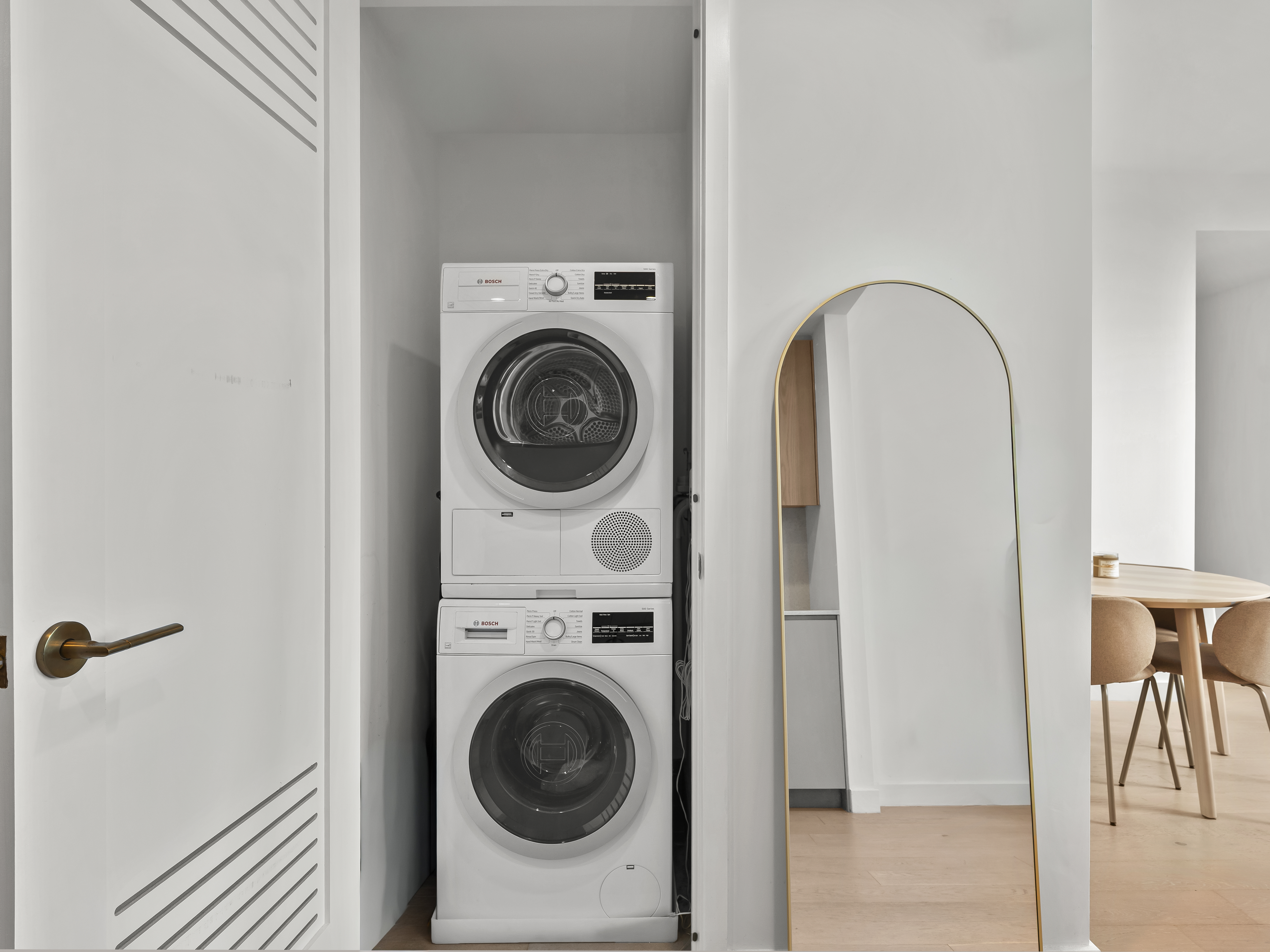45-3 Court Square, Unit 4406 Queens, NY 11101 - Photo 11 of 22 a view of a hallway with washer and dryer