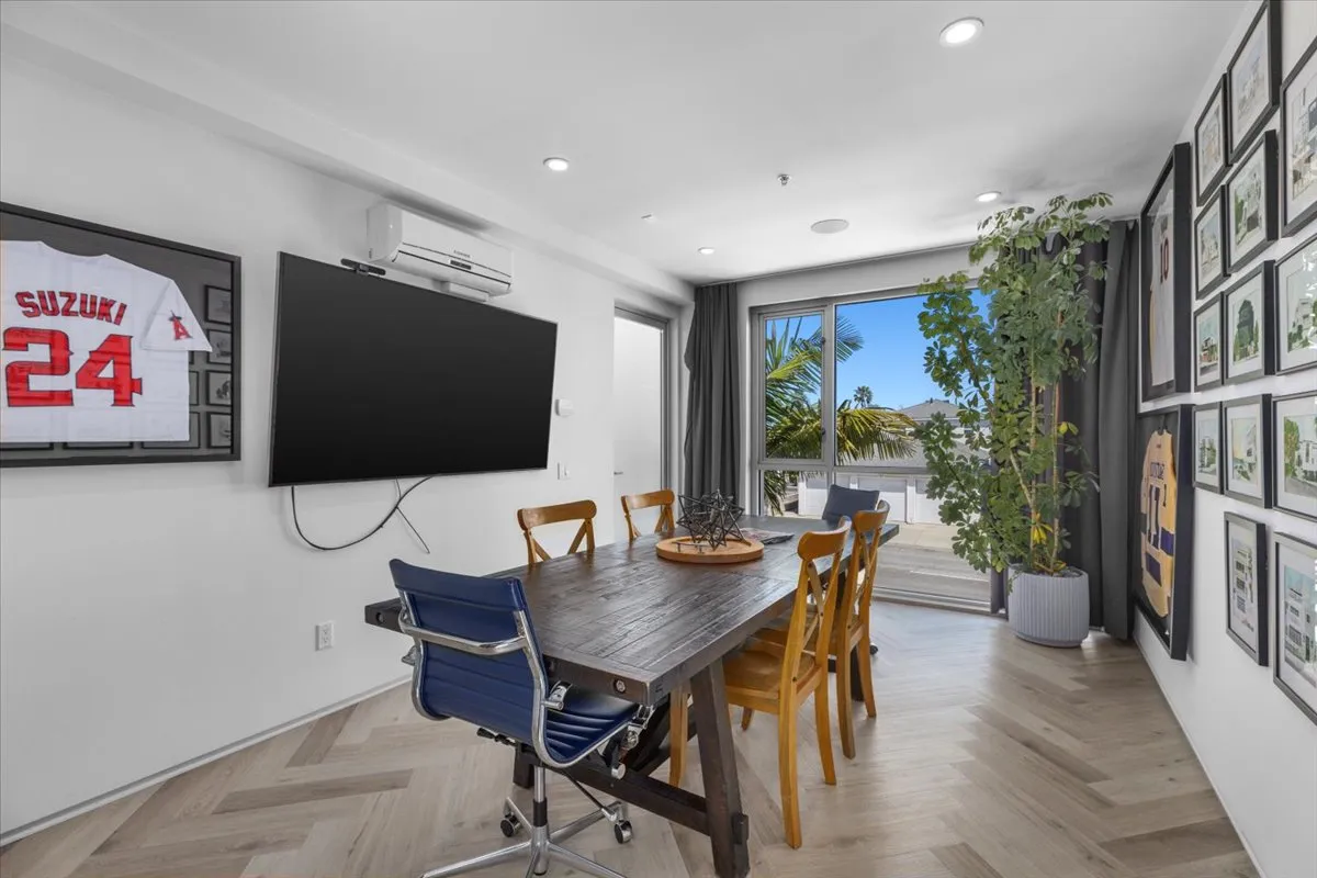 a view of a dining room with furniture window and wooden floor