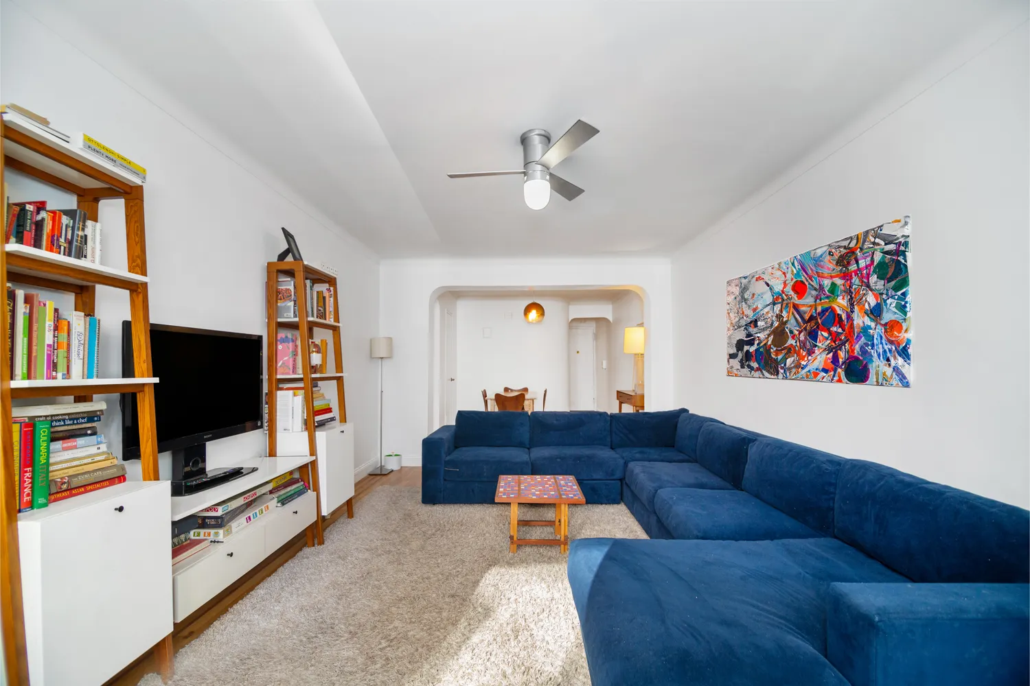 a living room with furniture and a flat screen tv