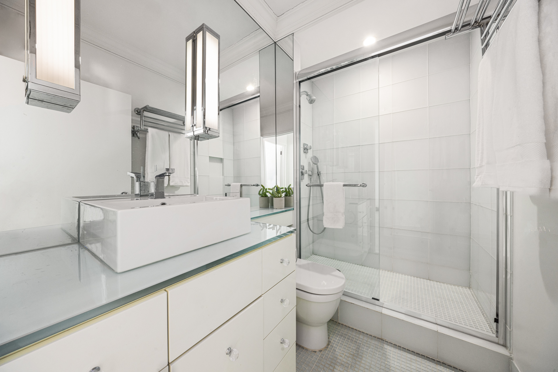32 East 76th Street, Unit 805 Manhattan, NY 10021 - Photo 7 of 15 a bathroom with a sink a toilet and shower