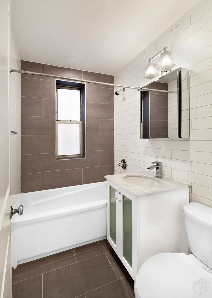 a bathroom with a sink a toilet and a bathtub