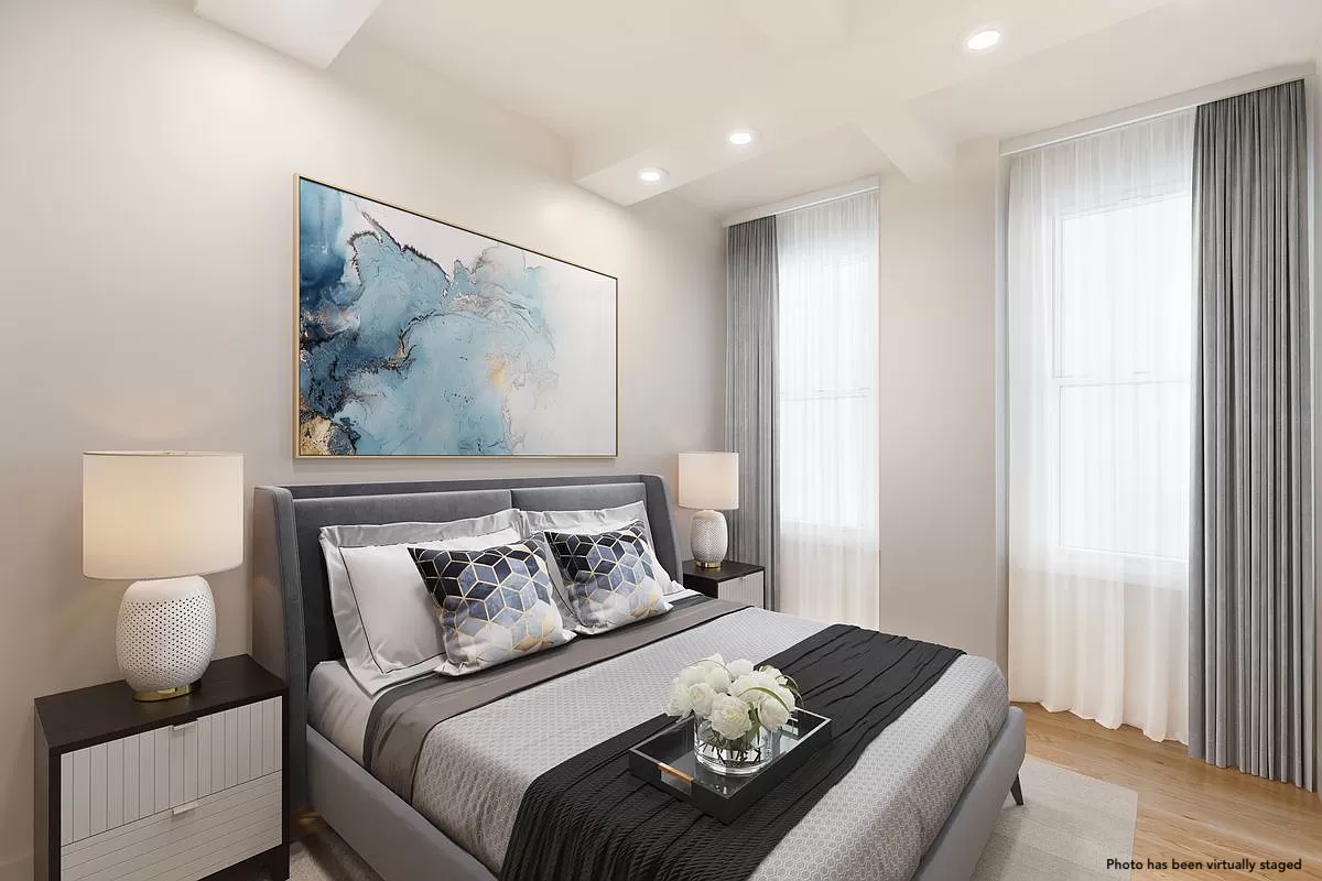 66 Madison Avenue, Unit 3BC Manhattan, NY 10016 - Photo 5 of 8 a bedroom with a bed and wooden floor