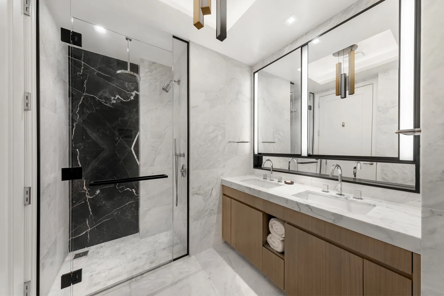 a bathroom with a double vanity sink mirror and double