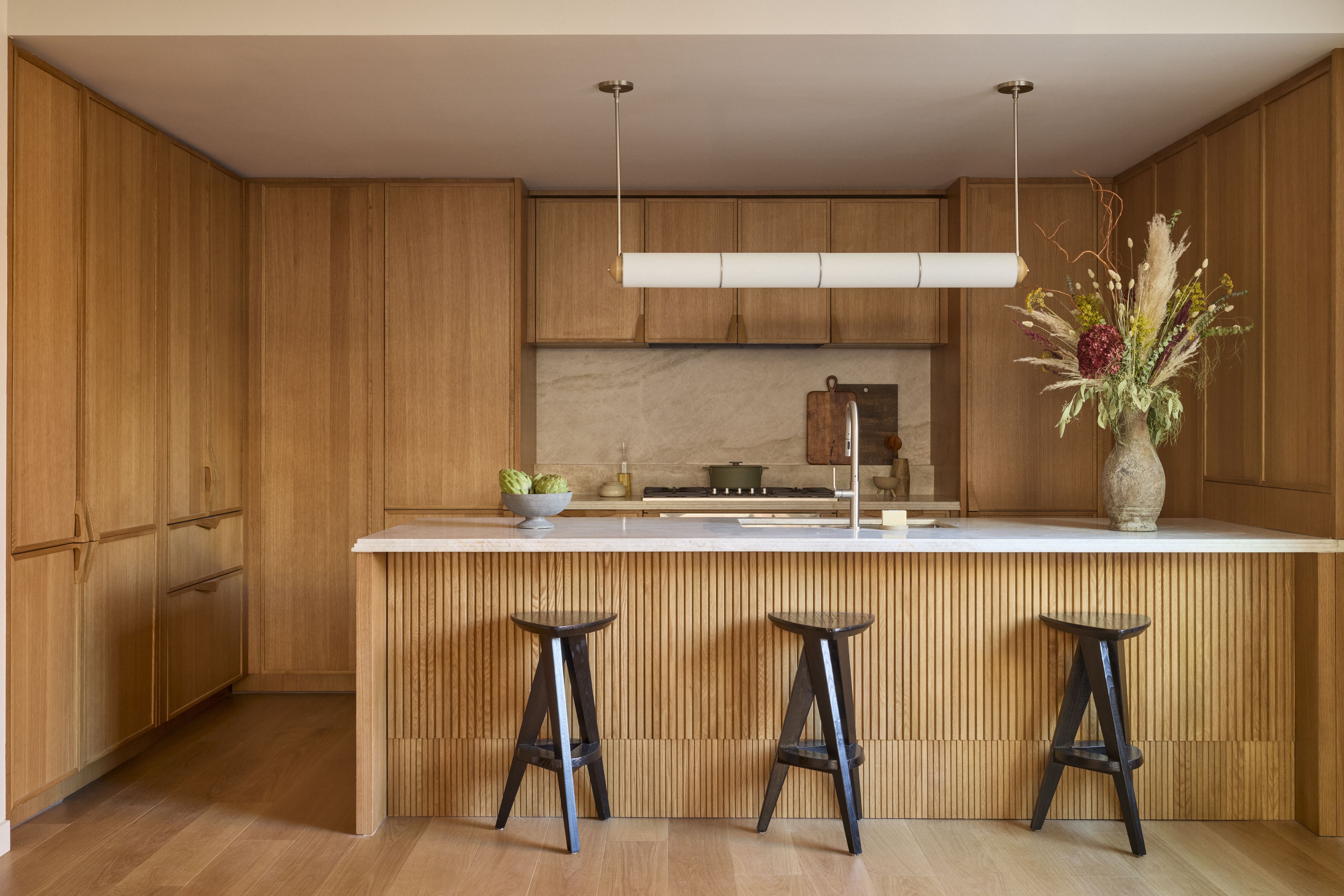 323 Bergen Street, Unit PH706E Brooklyn, NY 11217 - Photo 2 of 31 a kitchen with stainless steel appliances a table chairs in it and wooden floor