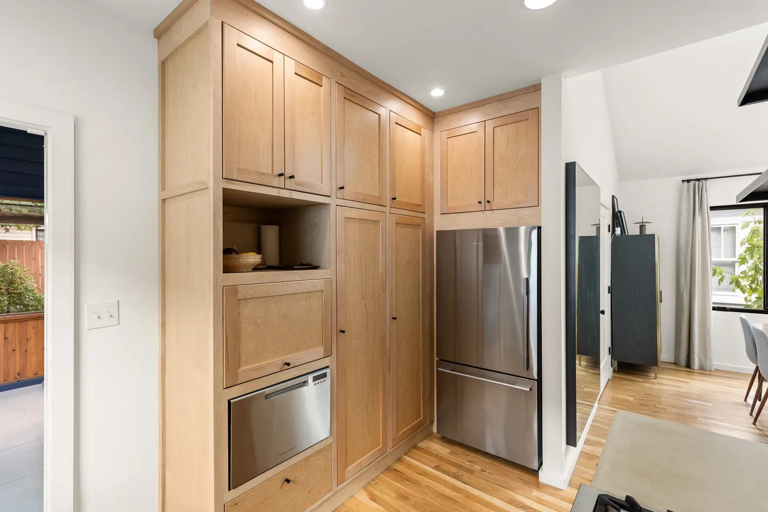 a kitchen with stainless steel appliances granite countertop a refrigerator and a sink