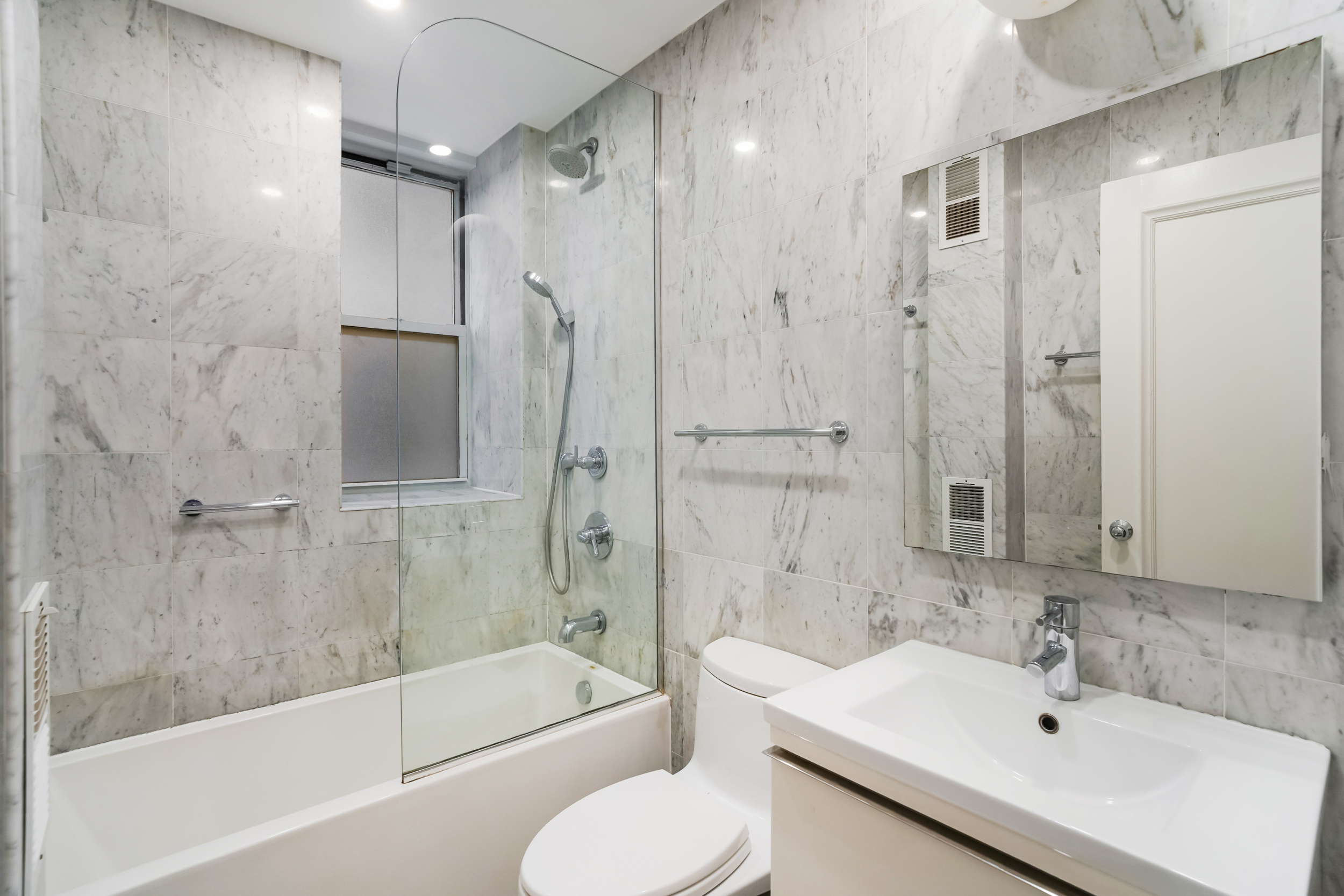 240 West 98th Street, Unit 3D Manhattan, NY 10025 - Photo 8 of 12 a bathroom with a sink toilet tub and shower