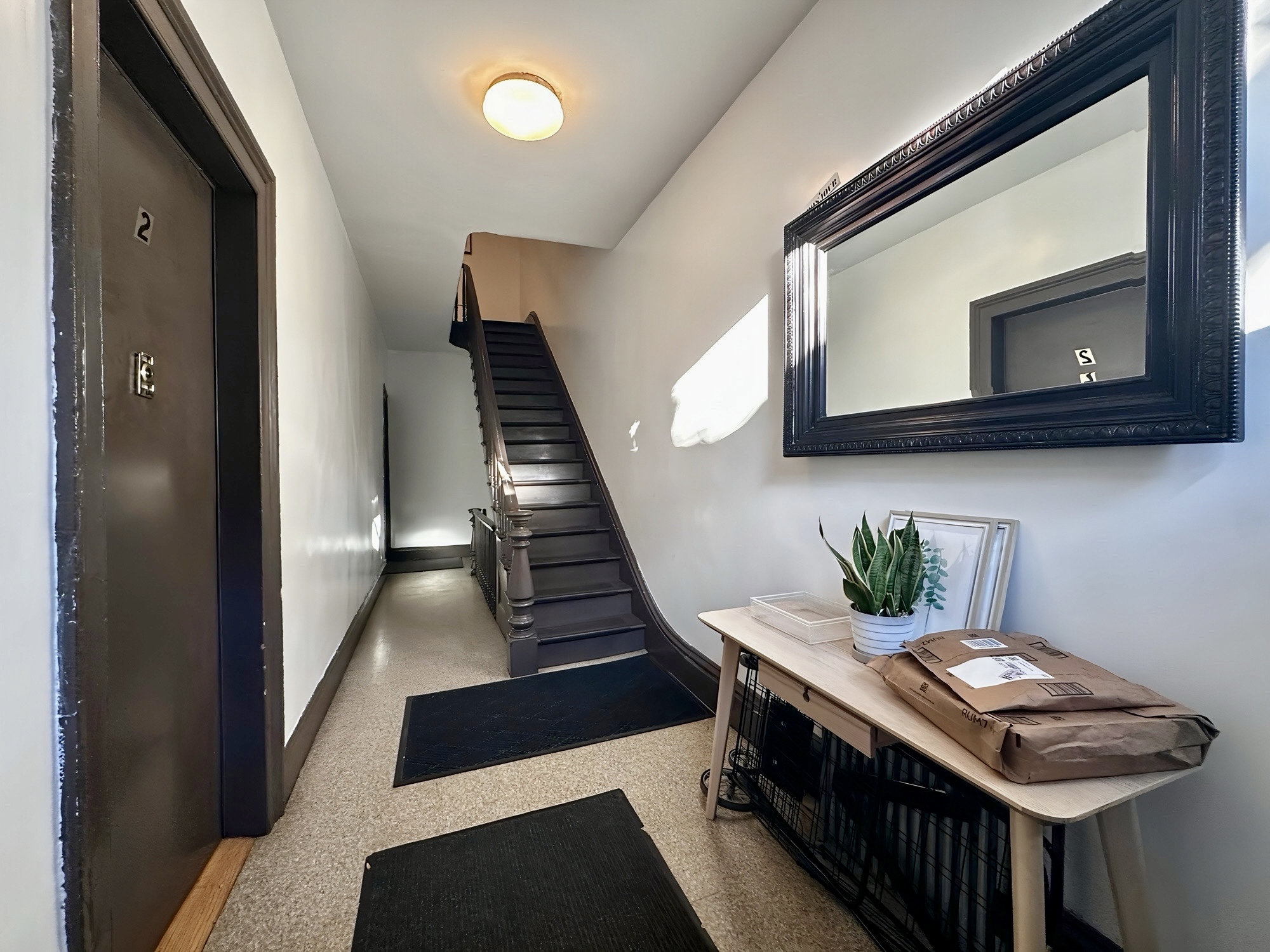 75 Warren Street, Unit 4 Brooklyn, NY 11201 - Photo 9 of 11 a room with furniture and stairs