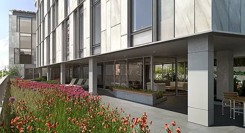 a view of a buildings with yard