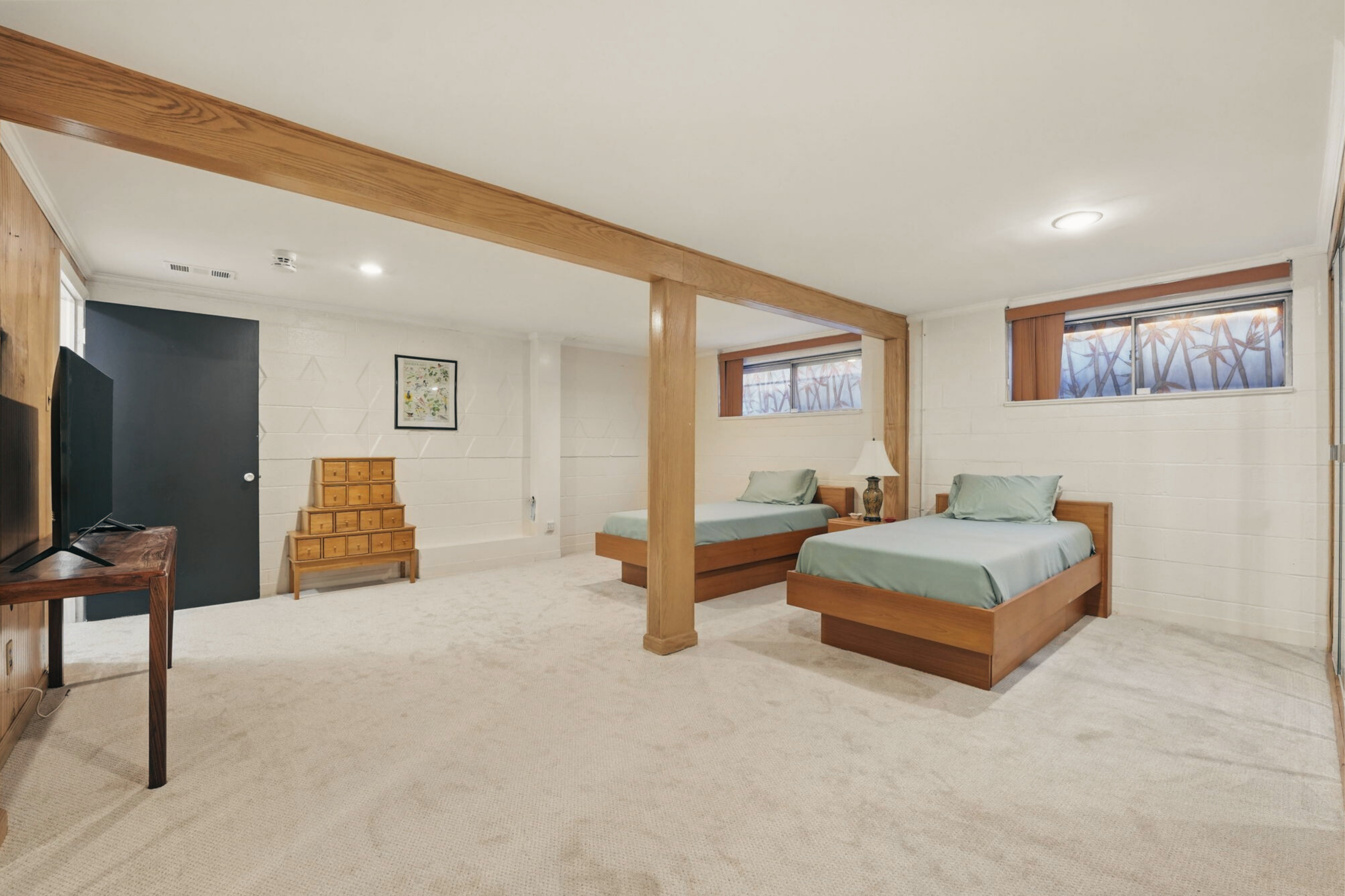 8003 16th Street Northwest Washington, DC 20012 - Photo 36 of 38 a spacious bedroom with a bed and a flat screen tv