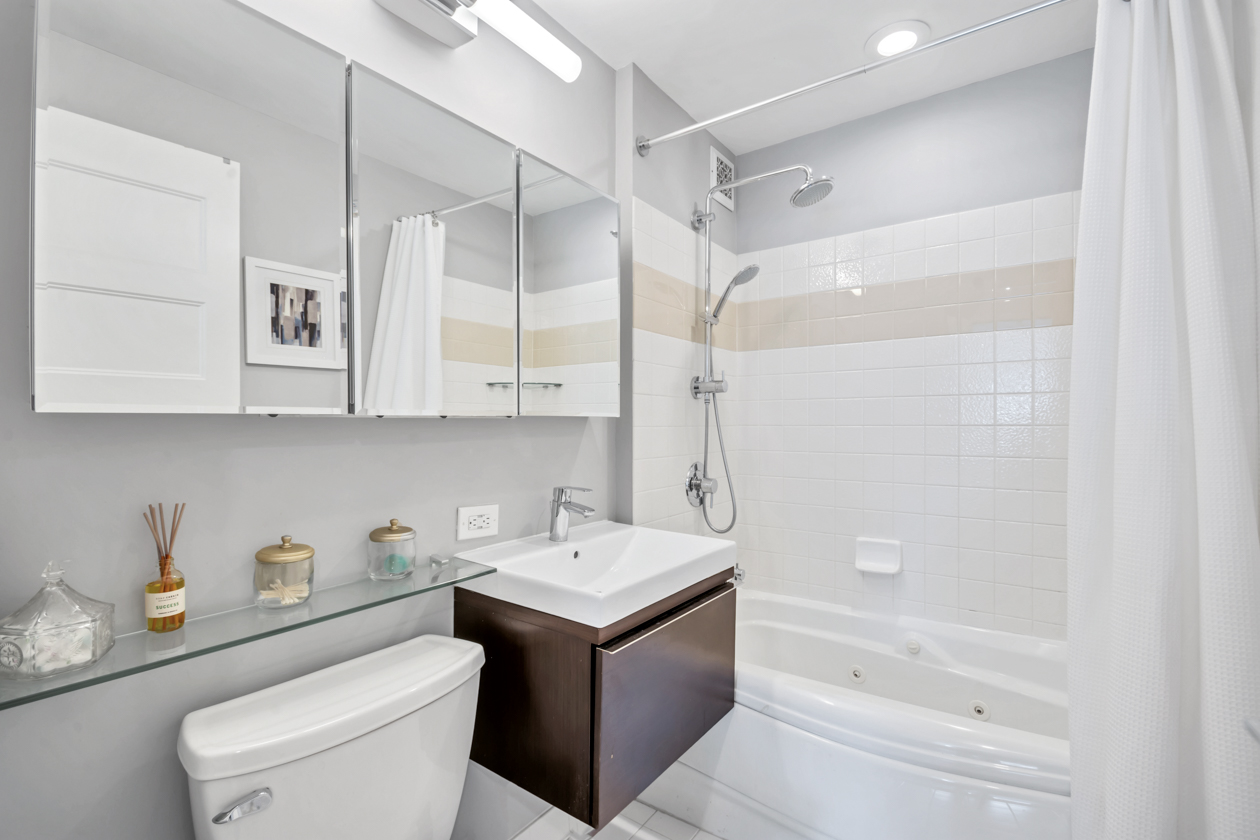 1400 5th Avenue, Unit 6K Manhattan, NY 10026 - Photo 9 of 10 a bathroom with a sink a toilet and a bathtub