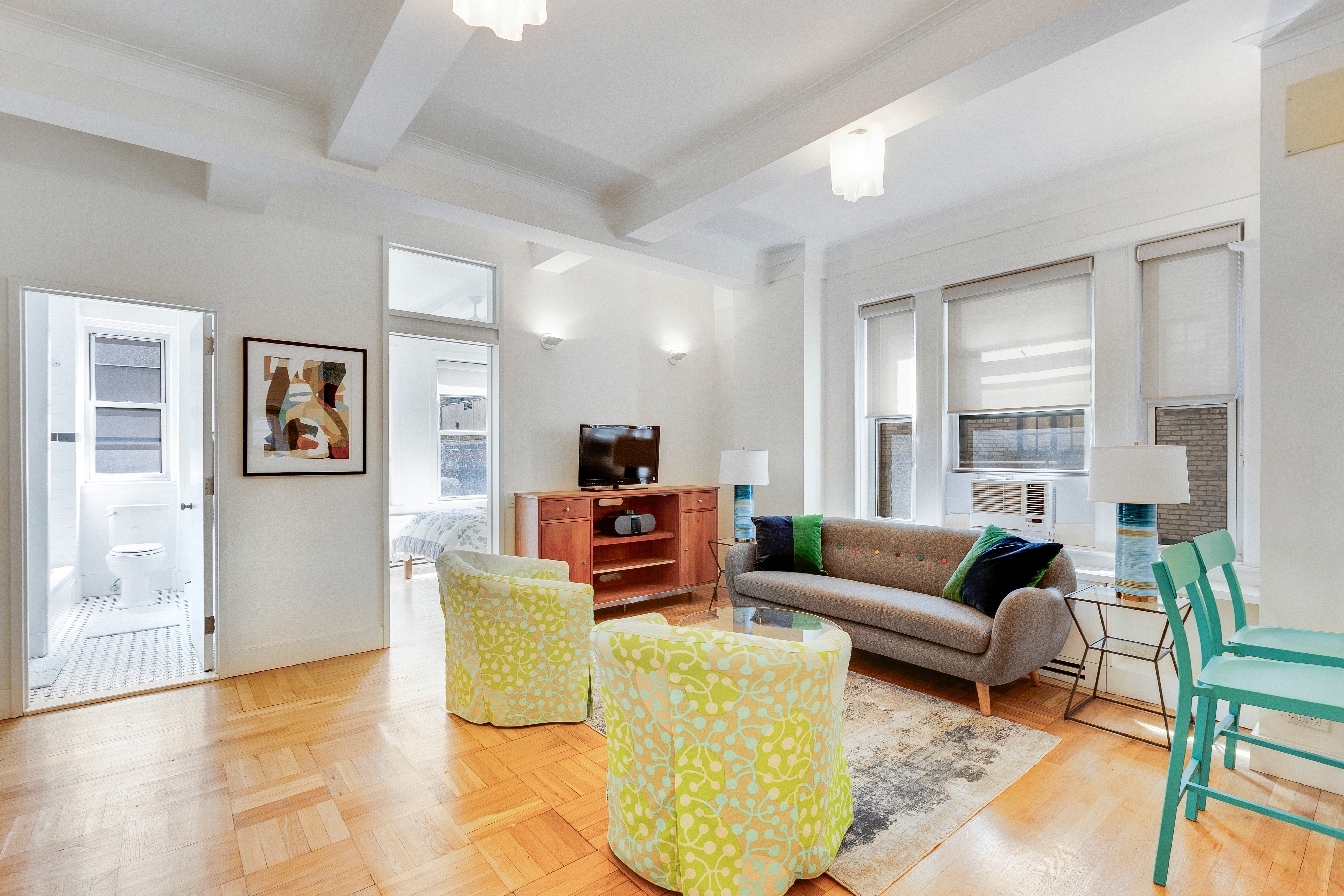 588 West End Avenue, Unit 6D Manhattan, NY 10024 - Photo 1 of 9 a living room with furniture and a large window