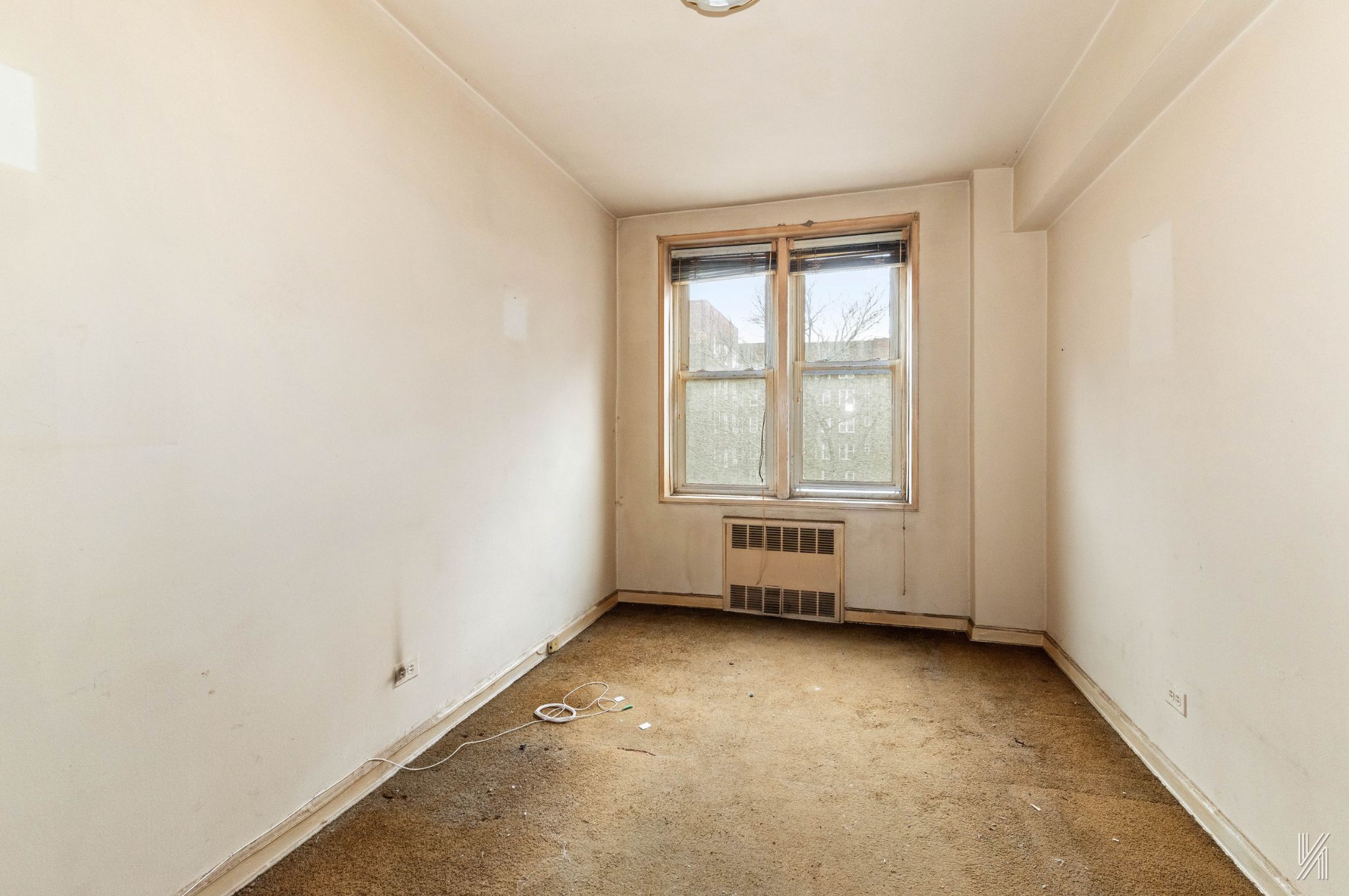 33-05 90th Street, Unit 4F Queens, NY 11372 - Photo 7 of 18 an empty room with windows