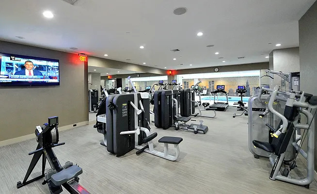 845 United Nations Plaza, Unit 56E Manhattan, NY 10017 - Photo 24 of 28 a view of a room with gym equipment
